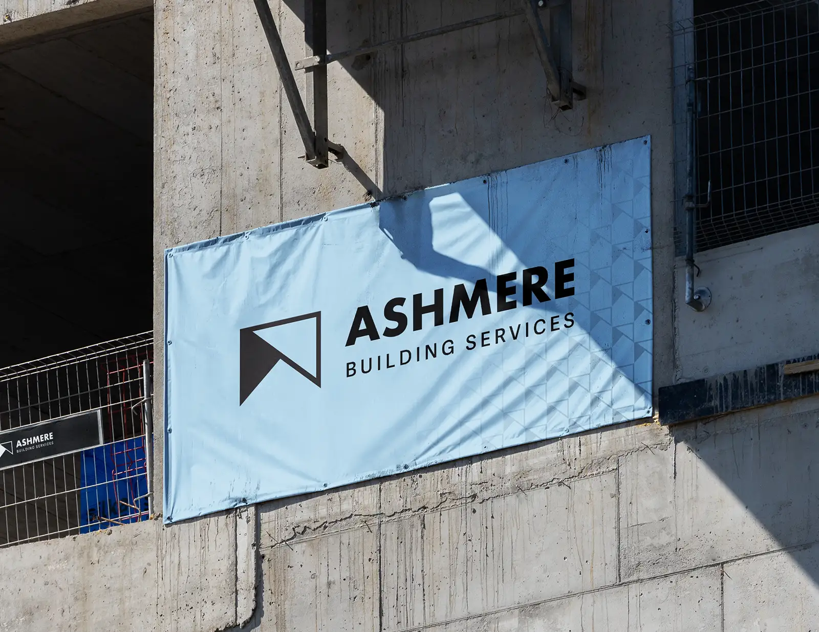Ashmere Construction branded banner on building site