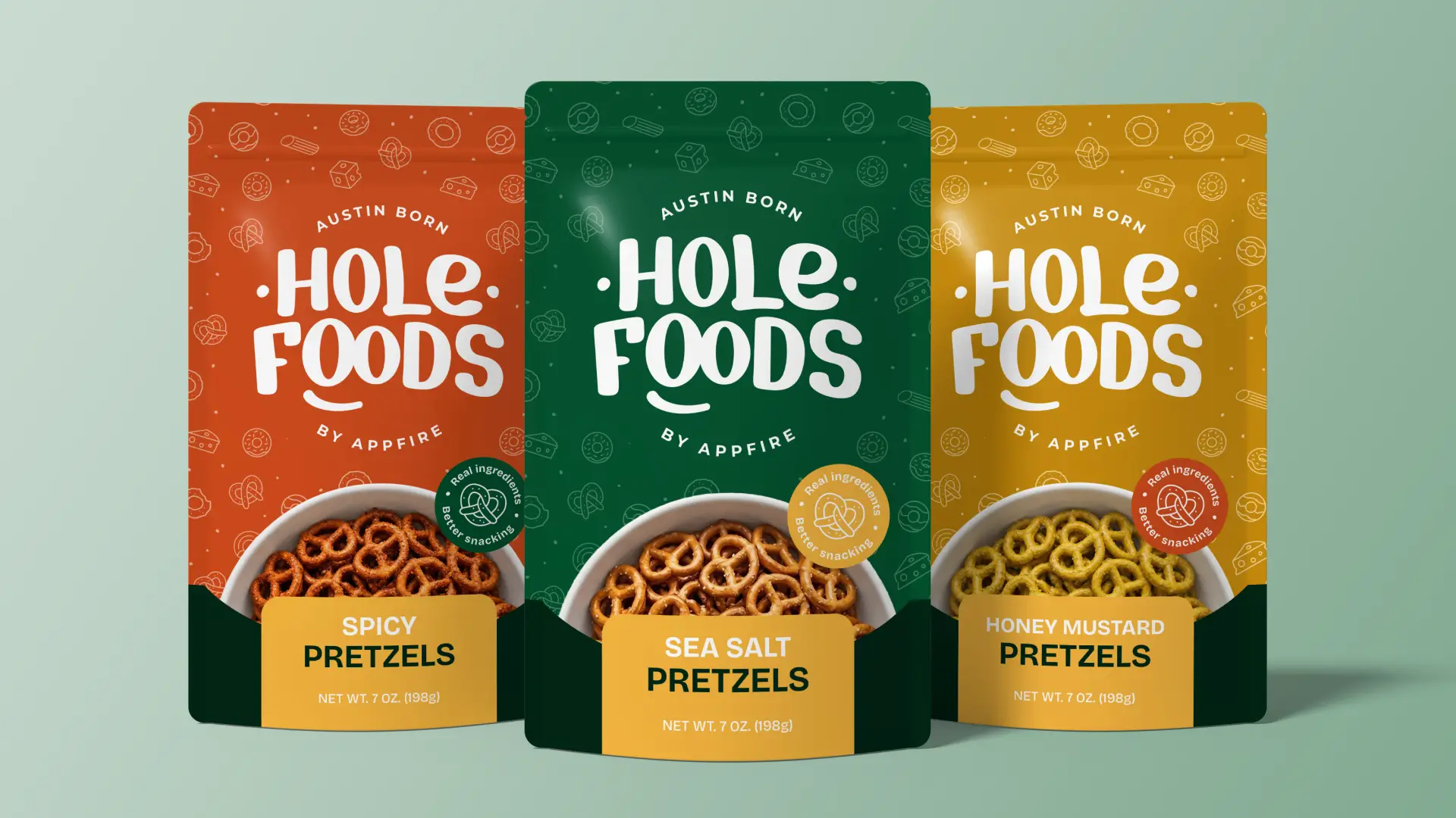 Three Hole Foods pretzel snack pouches in orange, green, and yellow, each with a bowl of pretzels on the front.