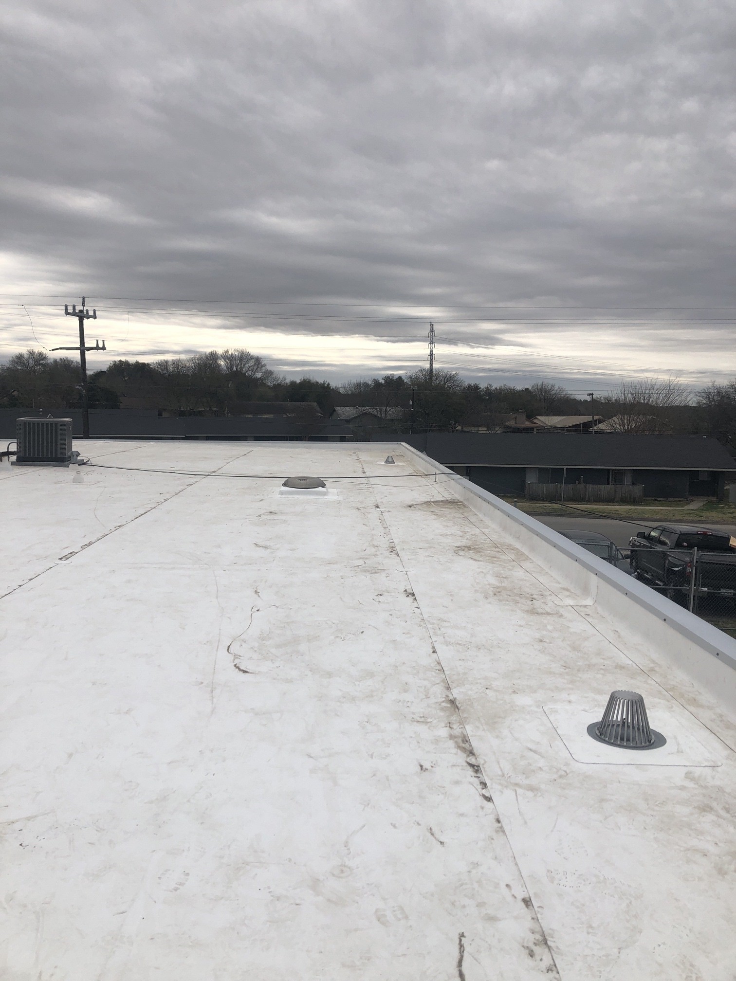 The junction between roof areas and perimeter details deserves inspection attention.