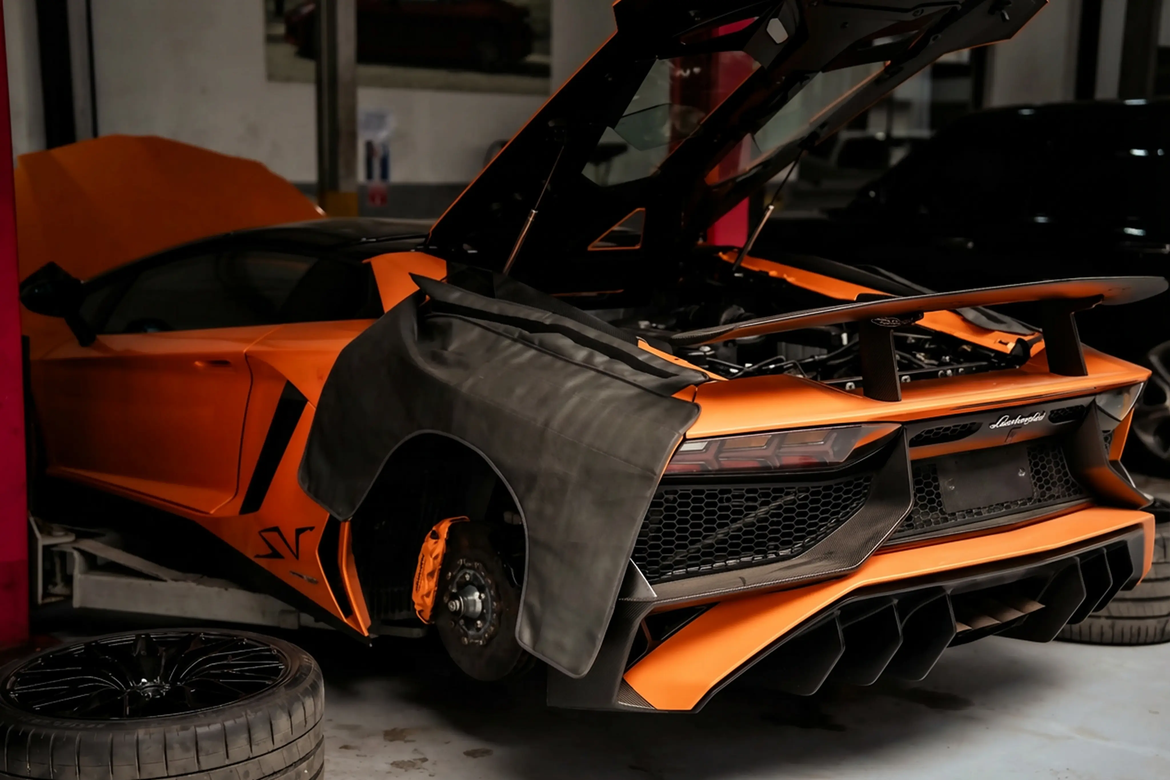 Lamborghini car parked and ready to be fixed