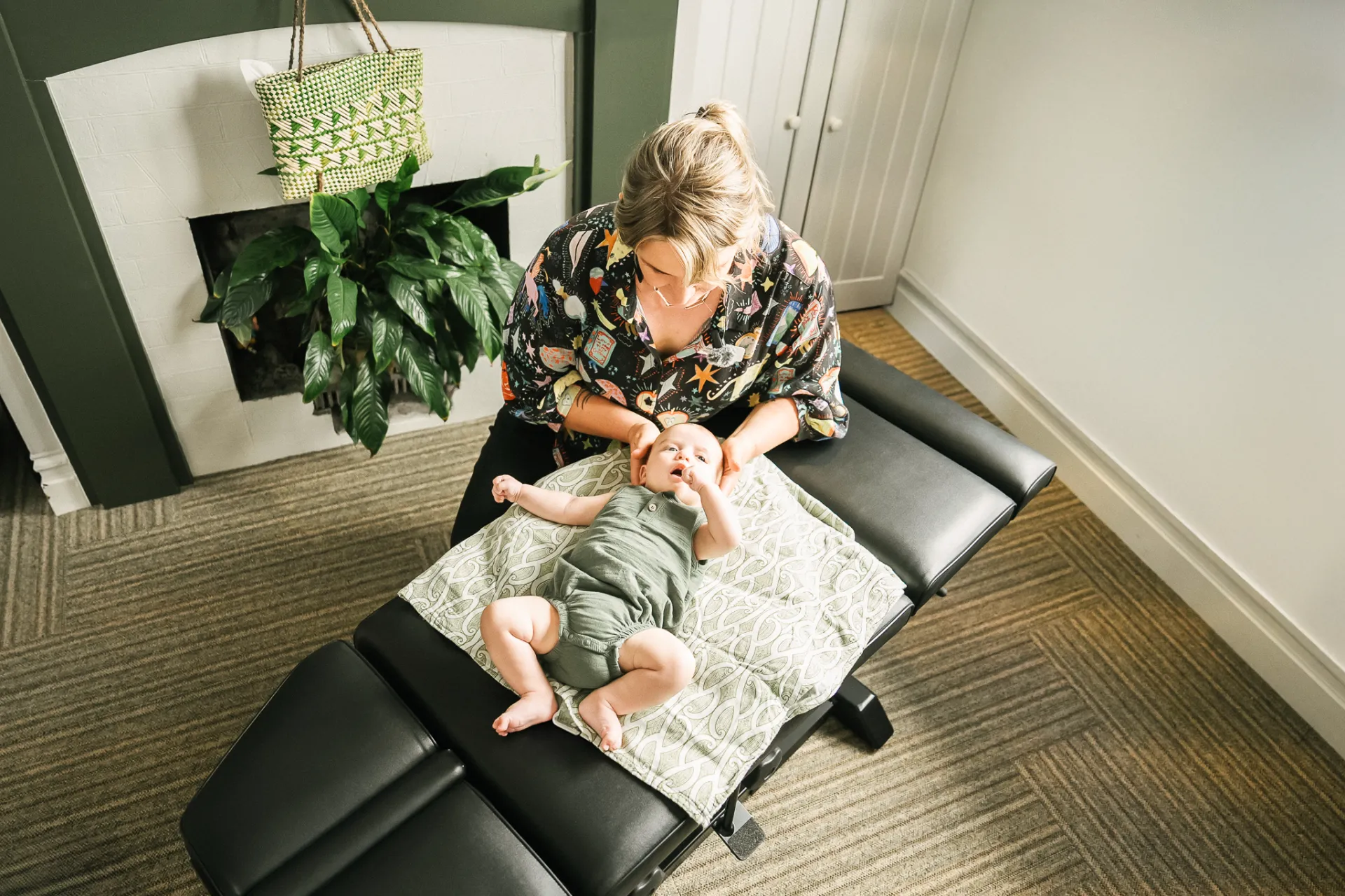 baby getting chiropractic