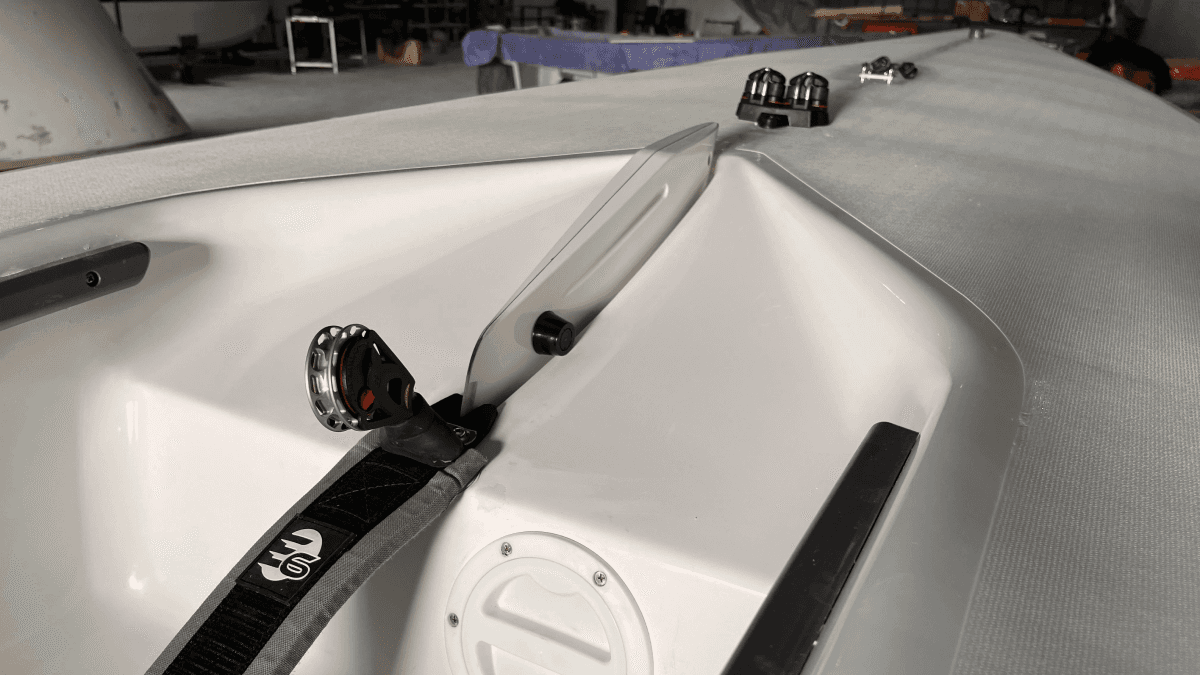 a person swimming in the water with grass