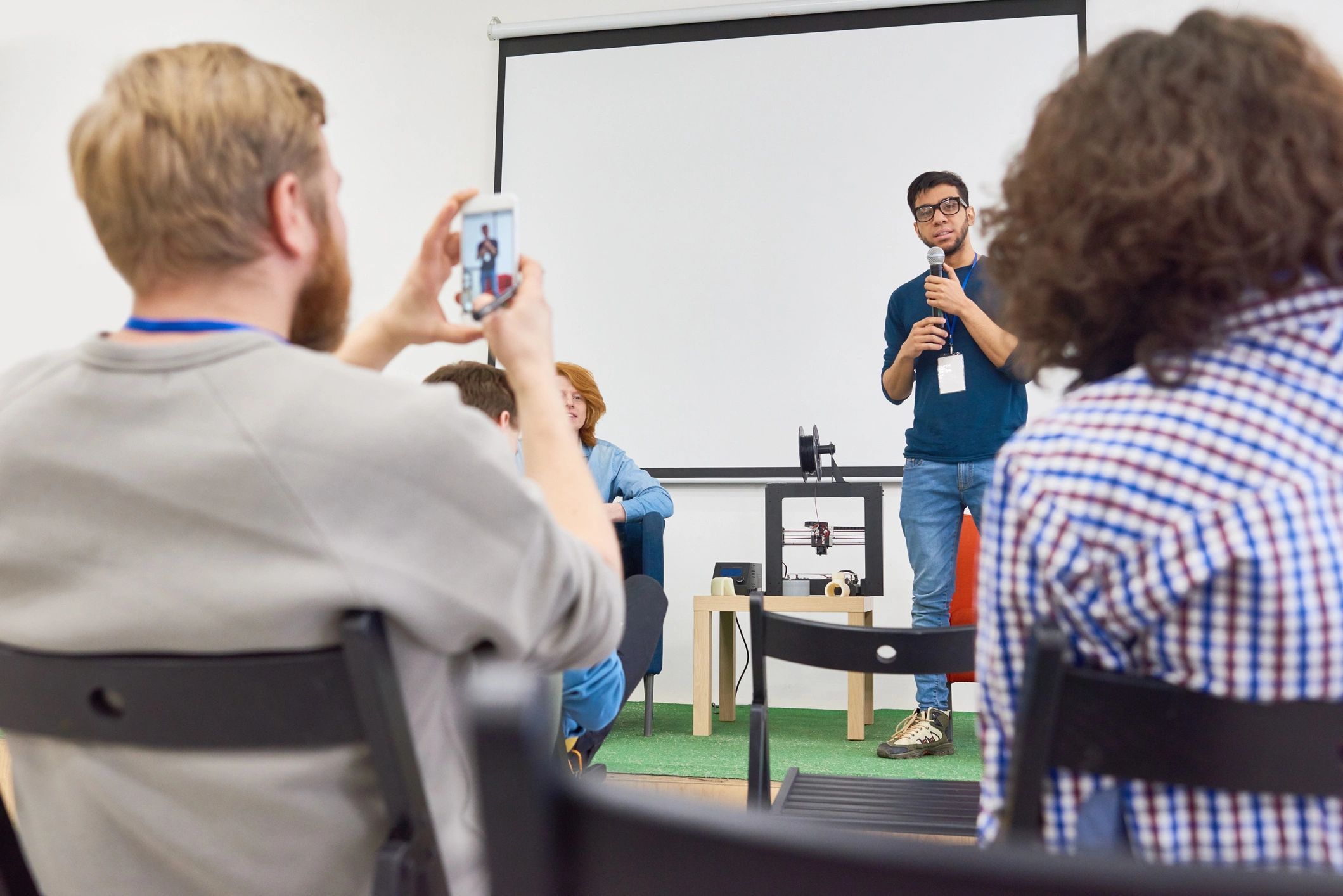 a black and white living room with a large tv