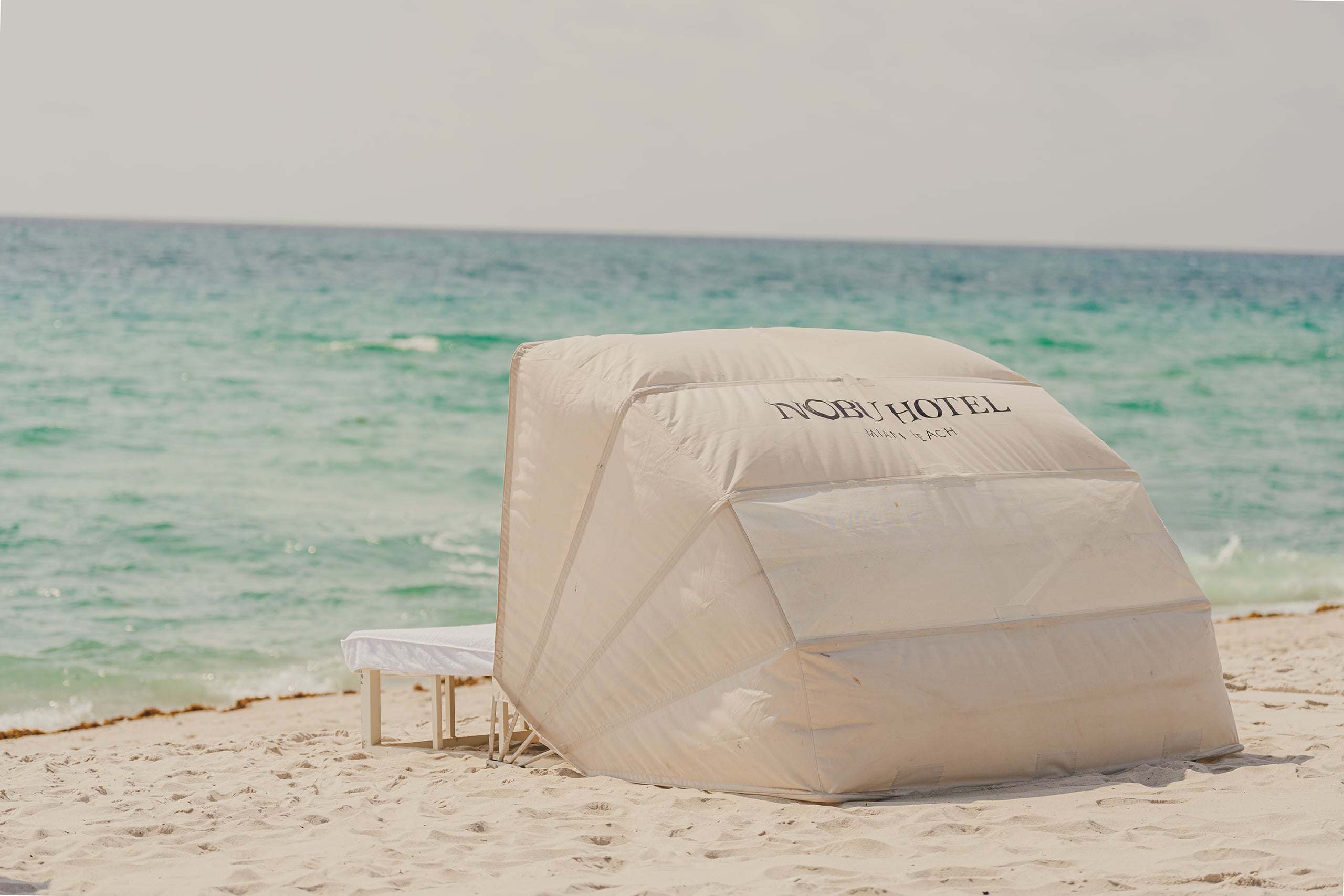 Moment 05 · The Beach — Mid-Beach Sand (Rockwell Inside the Lapidus)