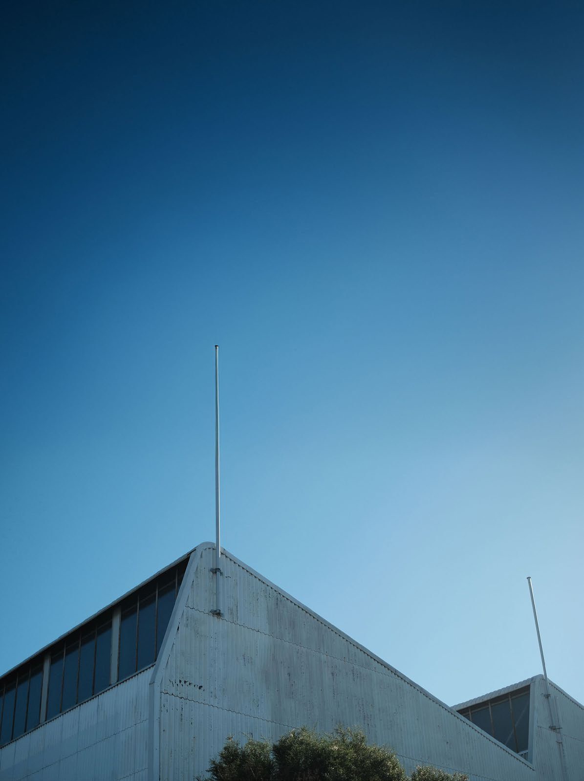 The ARM Hub building roofline against a clear sky
