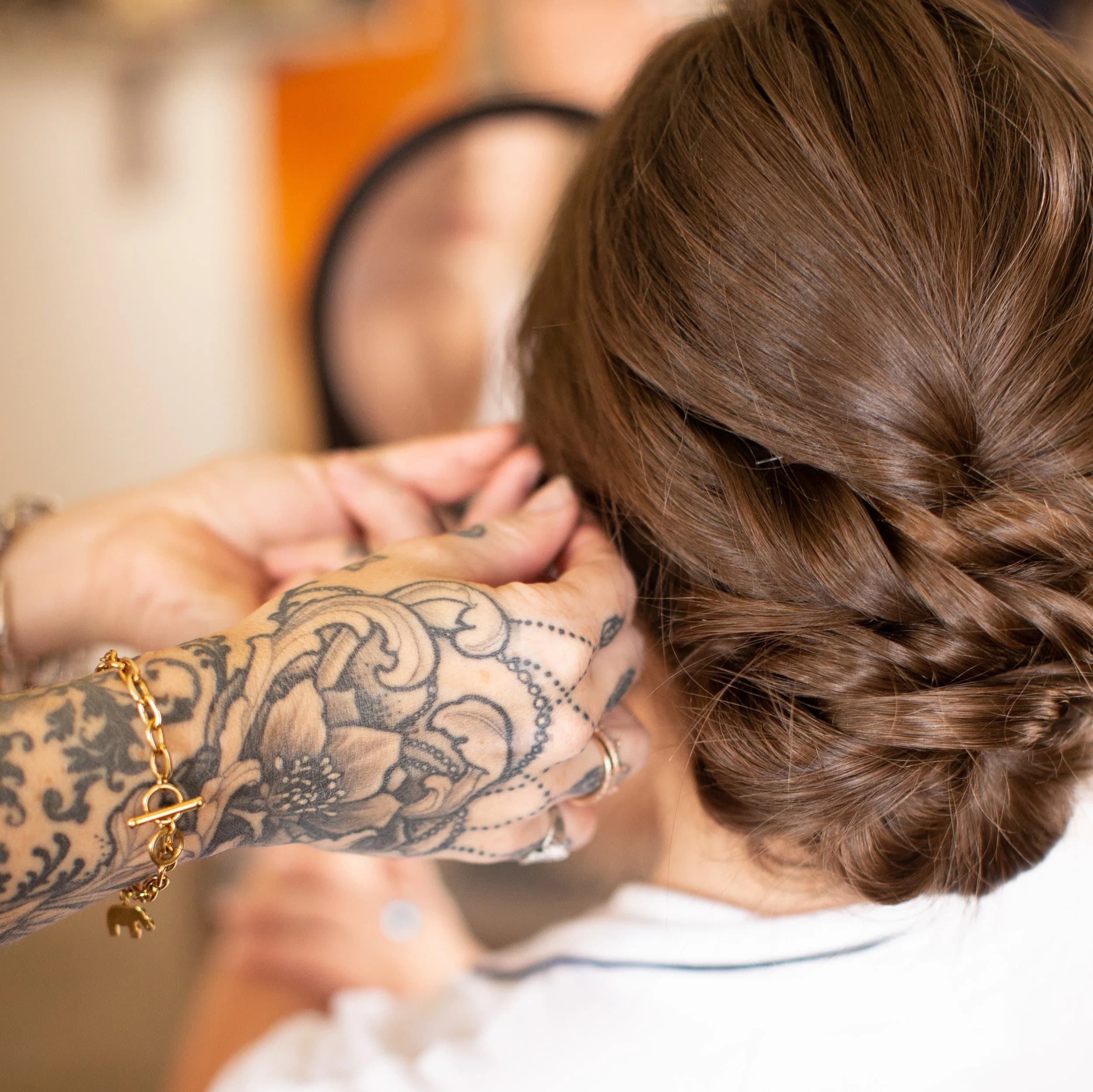 Close-up of brunette bridal updo with soft textured bun