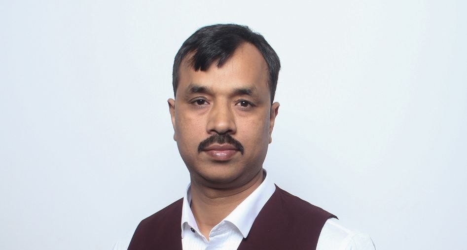 a man in a suit indoors