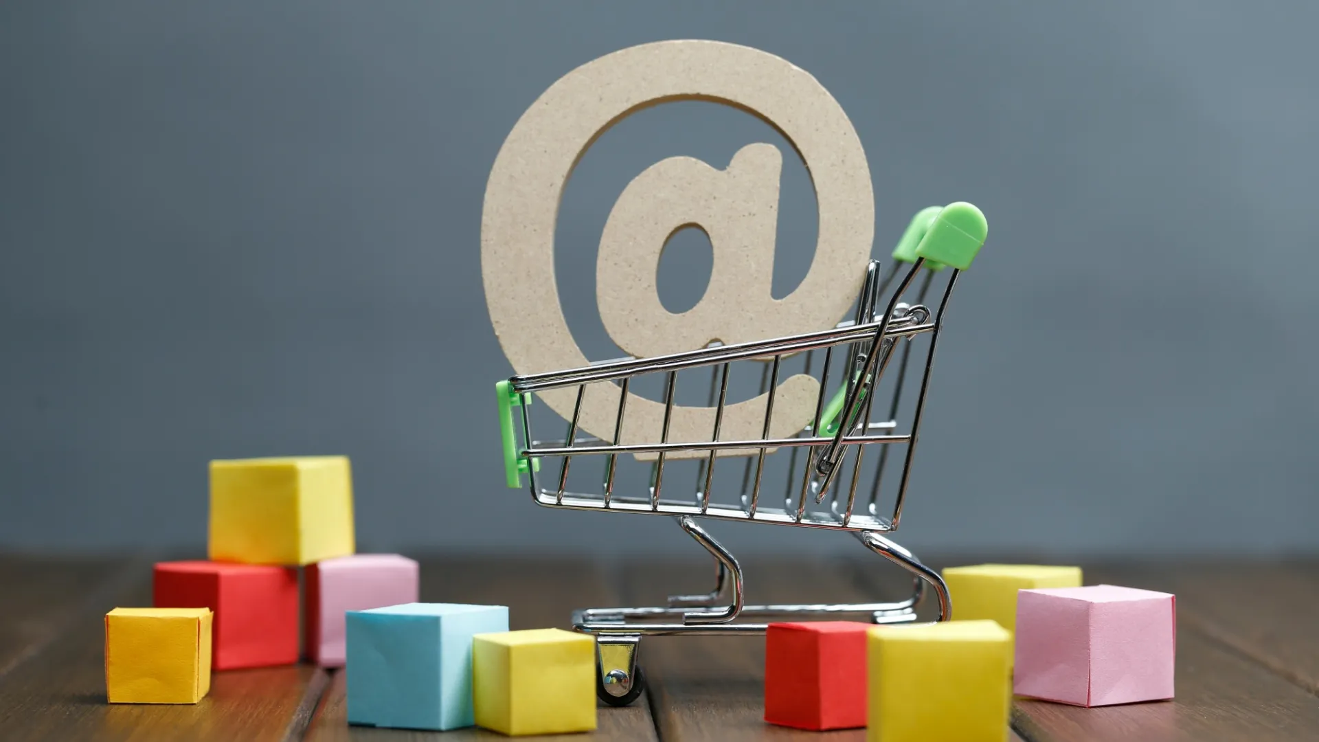 A shopping cart with an '@' sign, symbolizing how 'boomer' digital tactics don't work for modern TikTok Shop visibility.