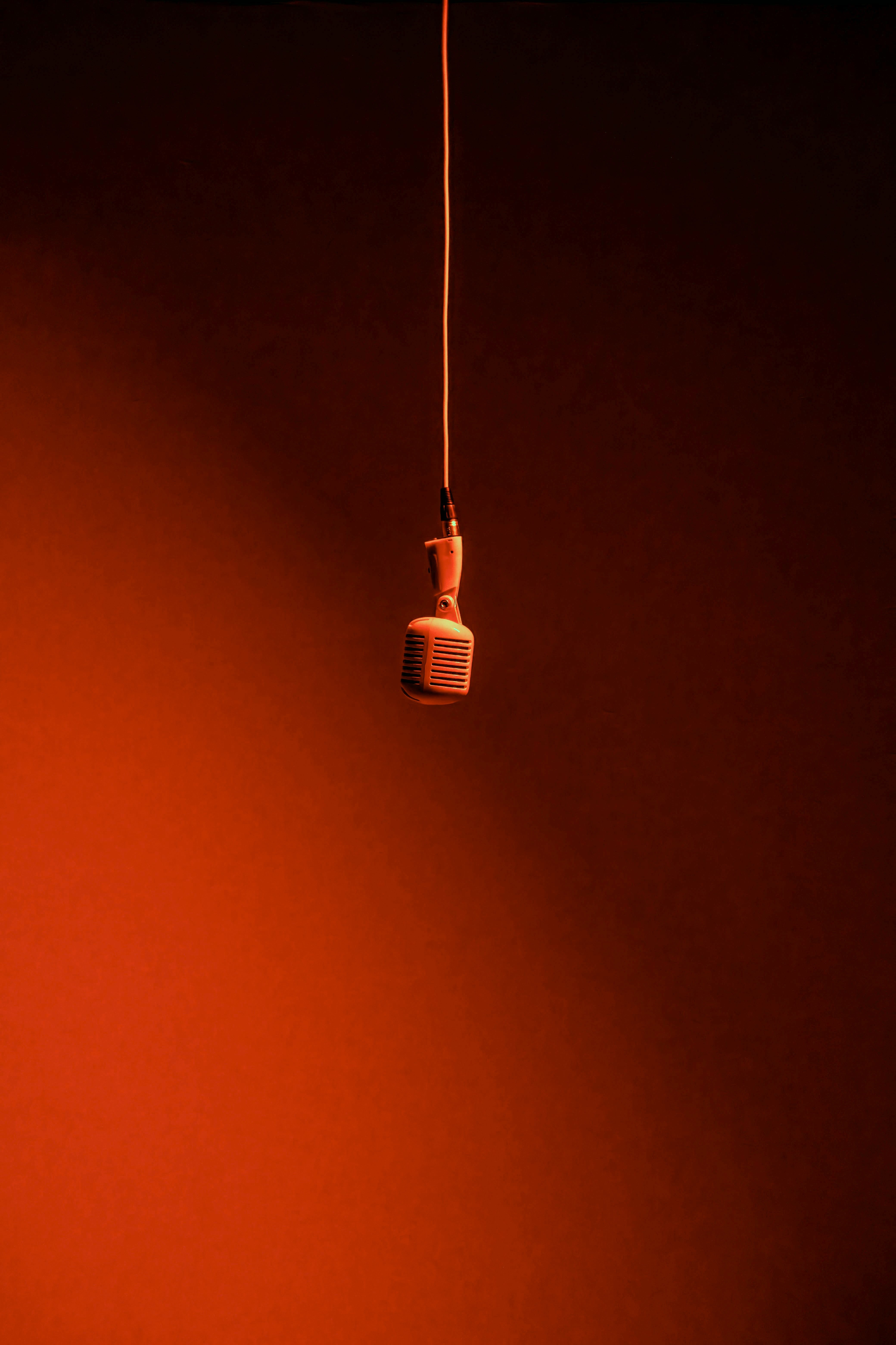 A close-up of a beige-colored laptop with a smooth, matte finish on a matching surface.