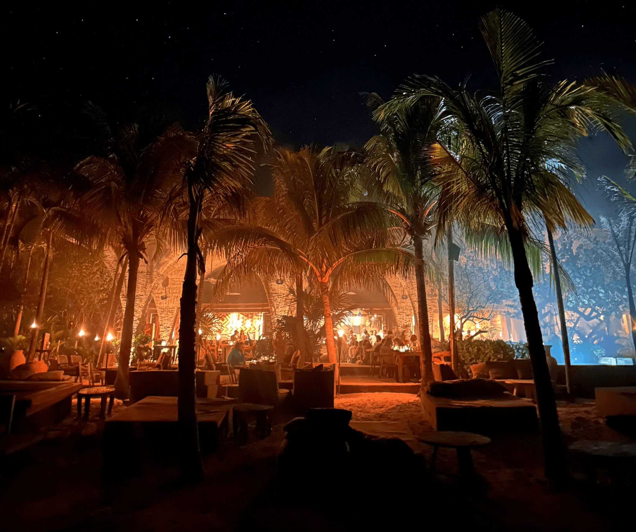 Guest relaxing on the beach, soaking up the sun and enjoying the ocean views at Nomade Holbox in Holbox Mexico