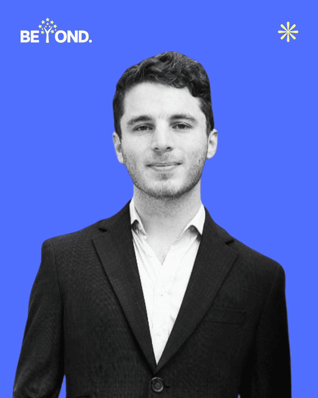 A confident person with short, styled hair and a leather jacket poses against a dark backdrop.