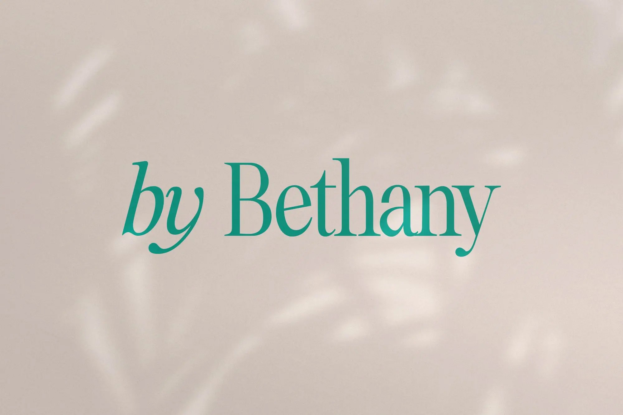 A black and white aerial photo of a surfer riding a wave. The image shows the surfer carving through the water, creating a dynamic spray of water around them.