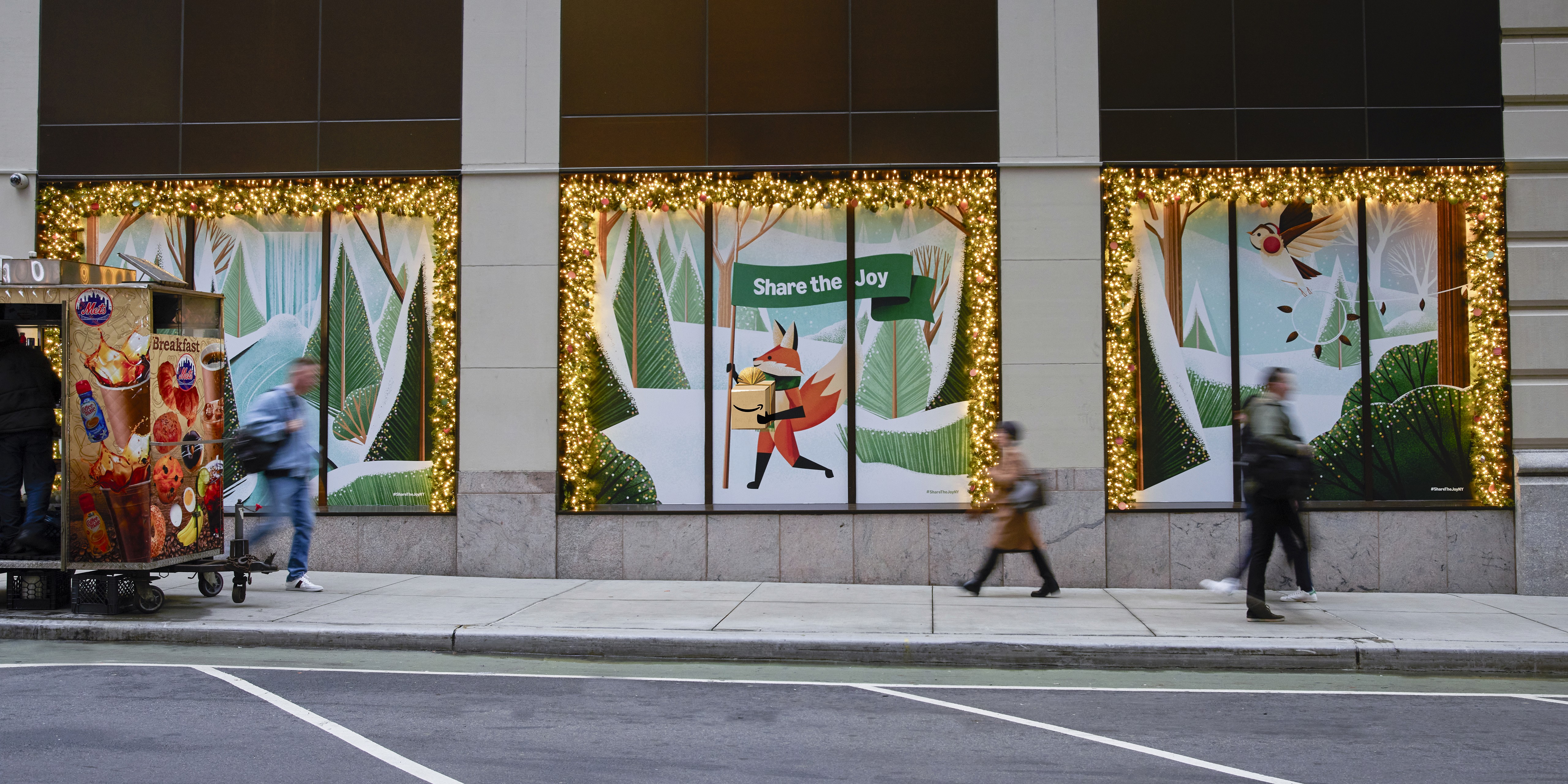 Streetside billboard with flyposters of the Batch.Works brand and illustrations