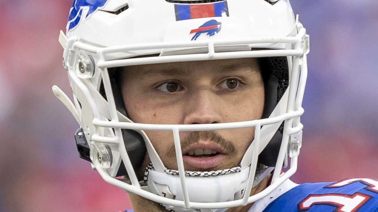 Josh Allen in his Buffalo Bills helmet looking through the facemask