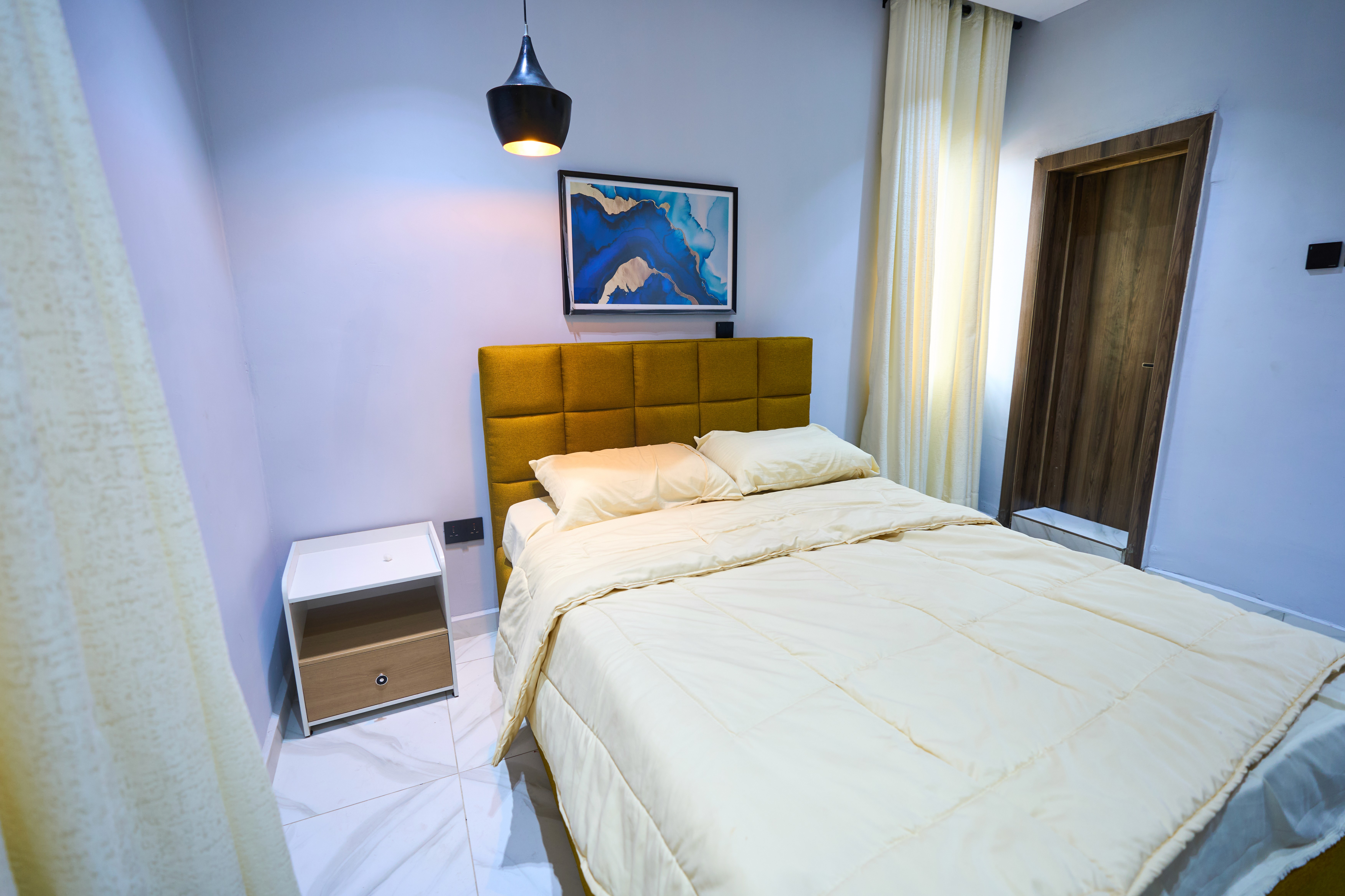 Spacious bedroom interior at Urban Suites, modern shortlet apartment in Surulere, Lagos
