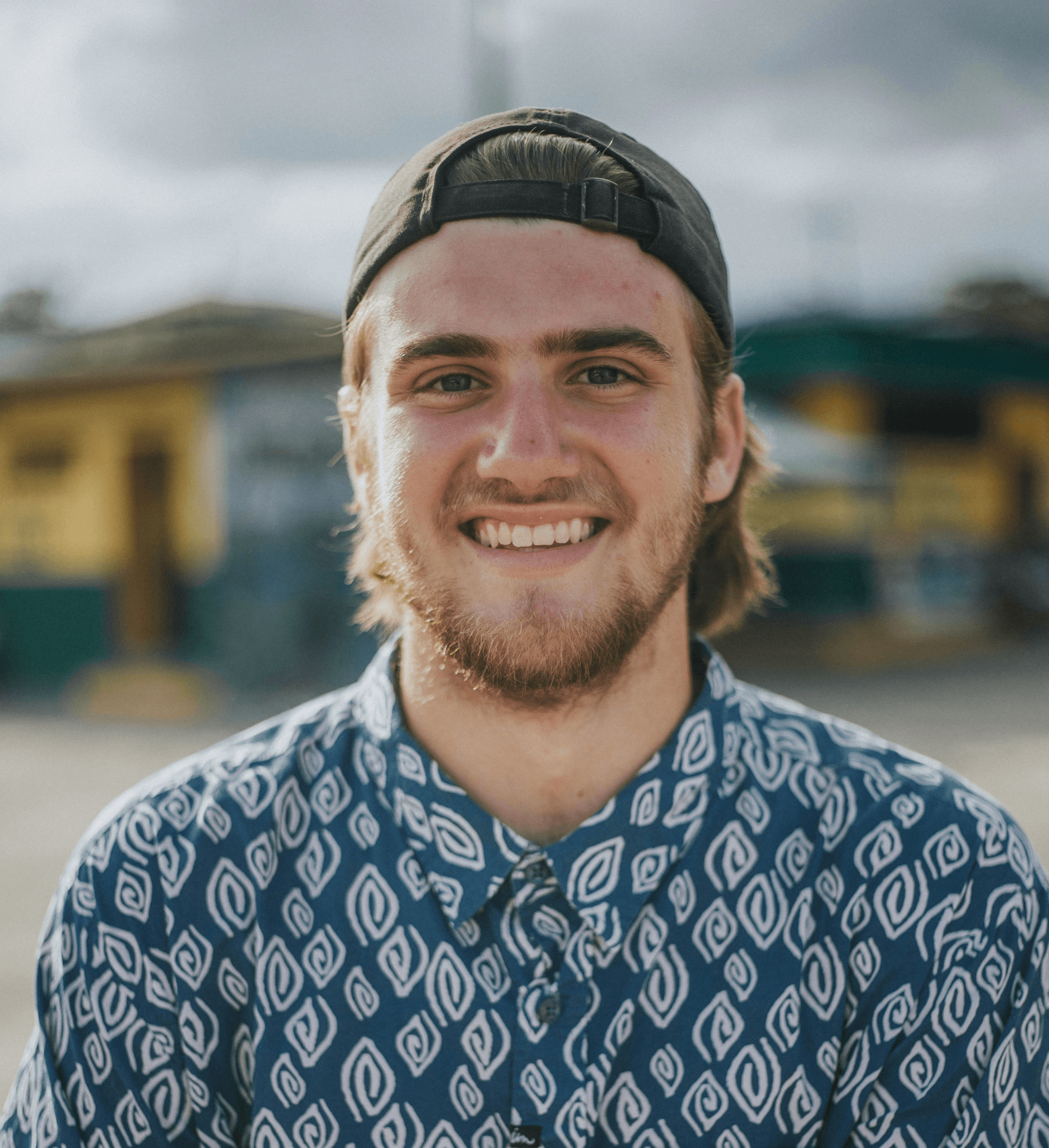 person wearing blue top smiling