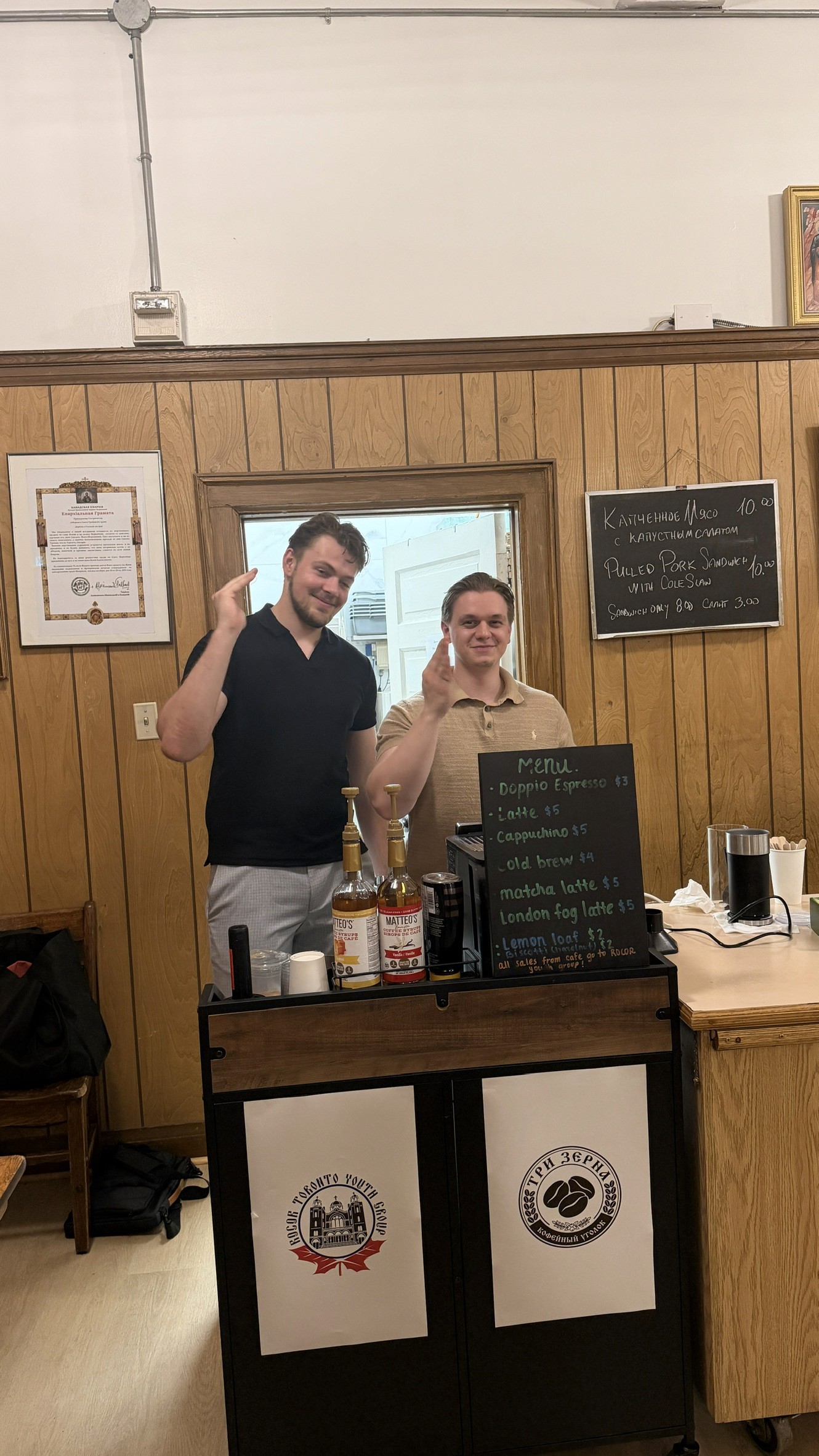 Youth group members serving coffee in the parish hall