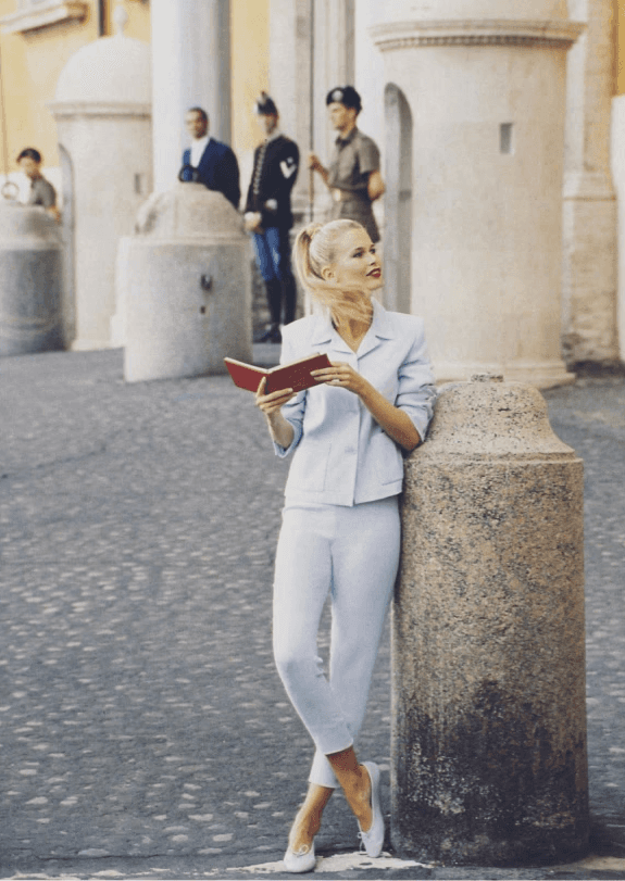 Modern architectural walkway with angled roof and sunlight.