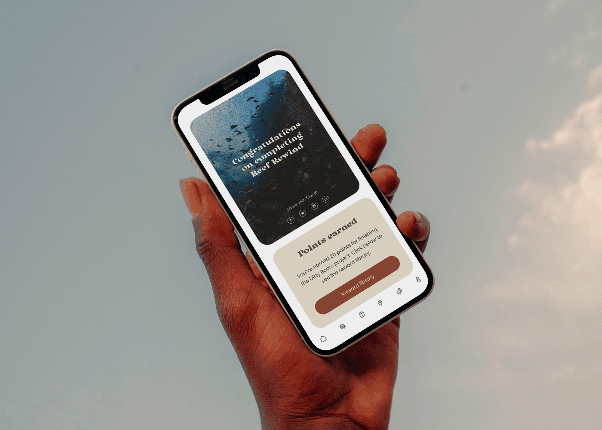 A phone being held in the sky showing the completion screen of an activity from the app.