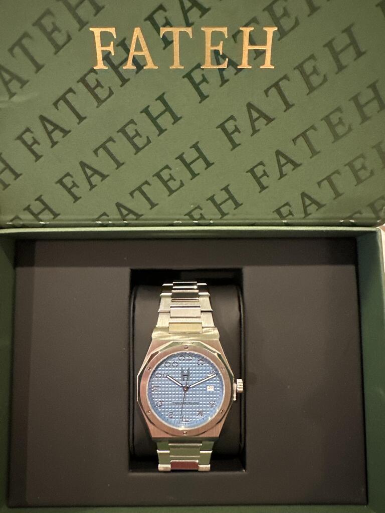 round silver-colored Rolex analog watch with link band