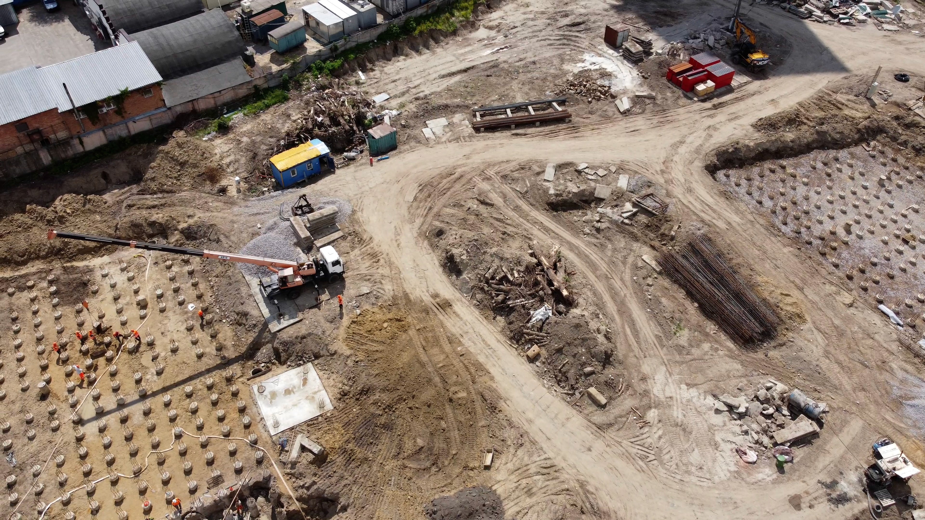 Colleagues collaborate while examining computer designs.