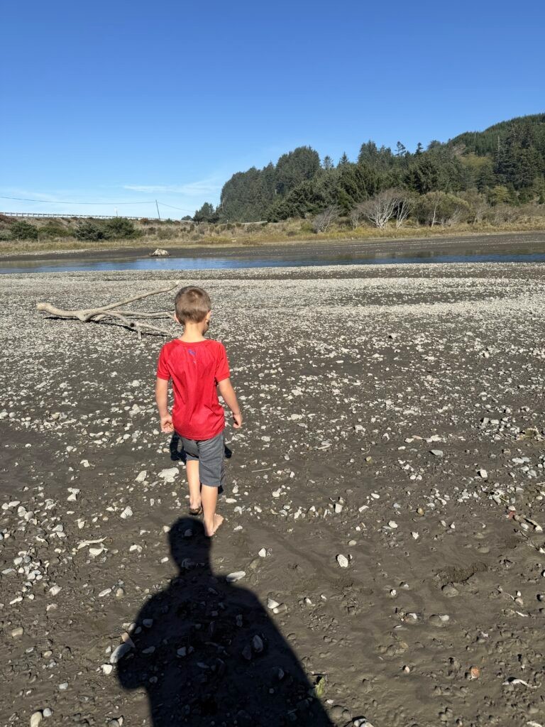 Our son walking along the Hunter Creek estuary near Turtle Rock in Gold Beach
