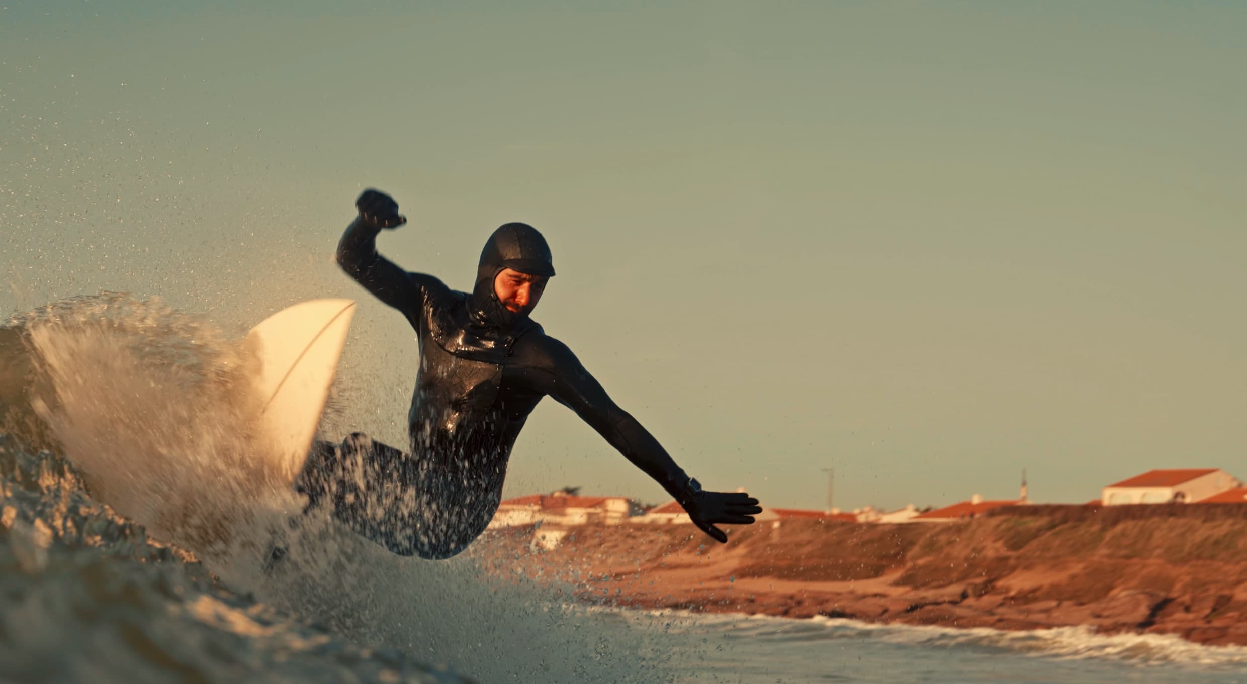 Person stand in front of a red sports oldtimer