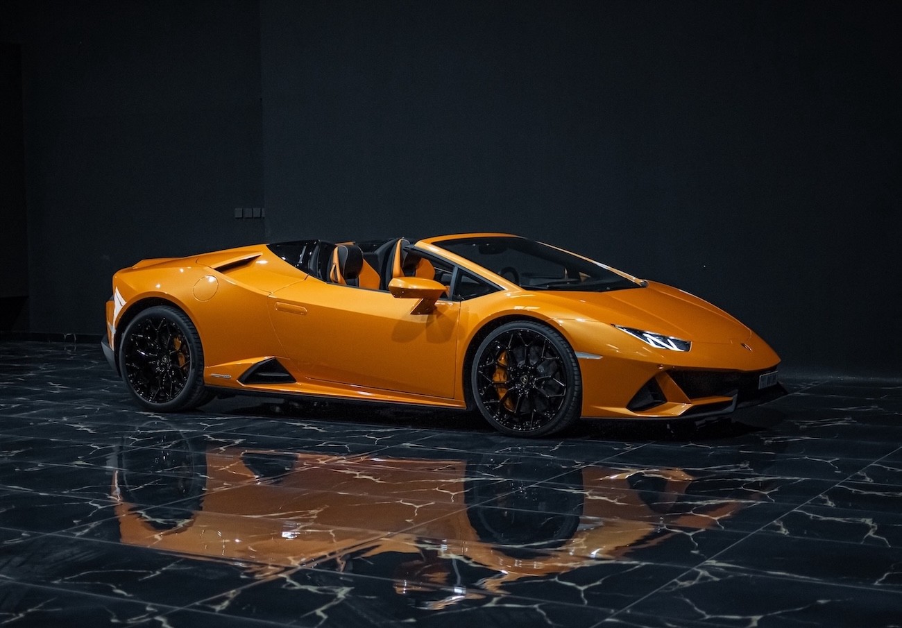 Lamborghini Huracán EVO Spyder AWD 2023 orange exterior front view luxury supercar rental Dubai