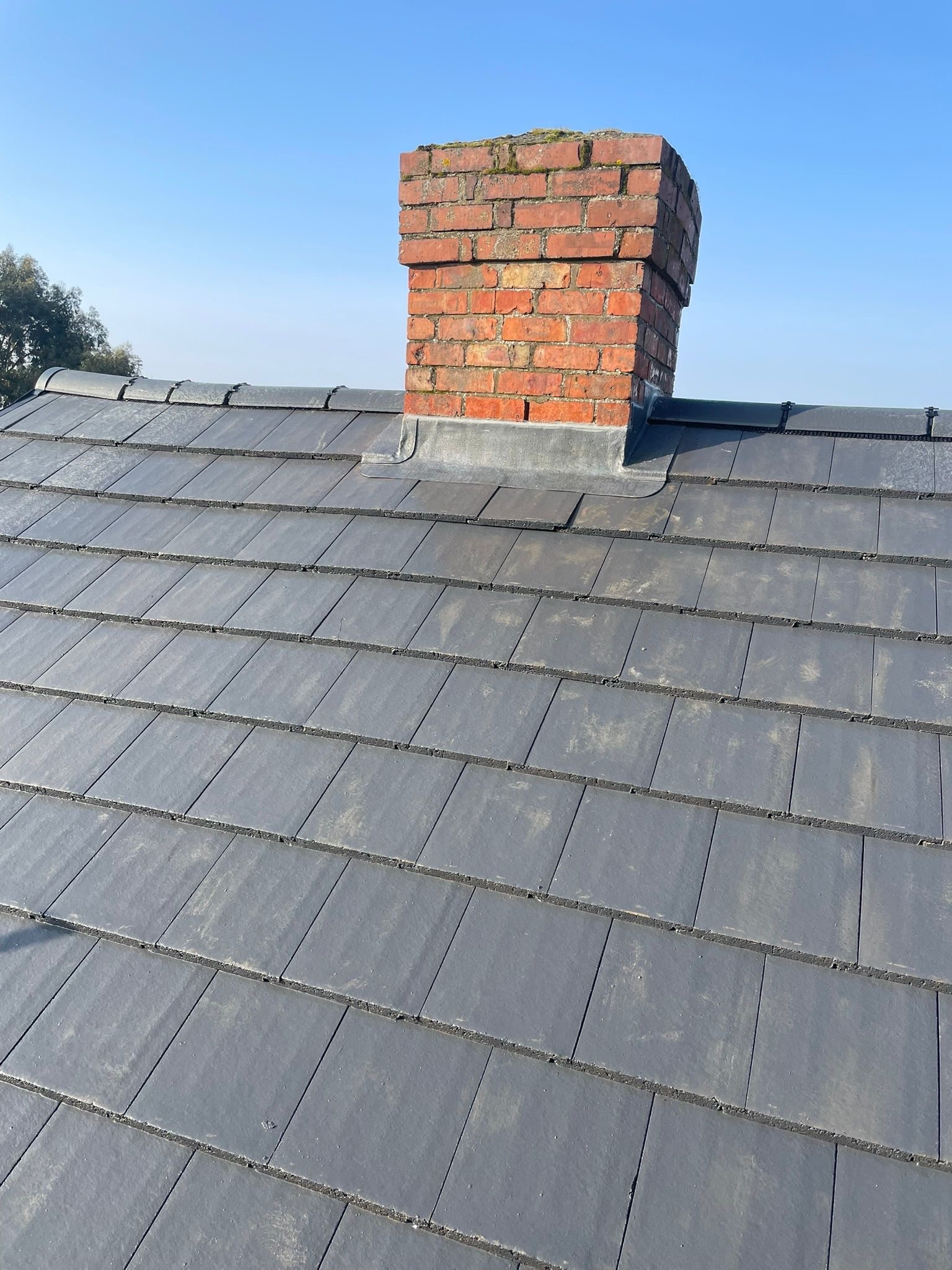 Roof repair addressing damaged tiles and leaks