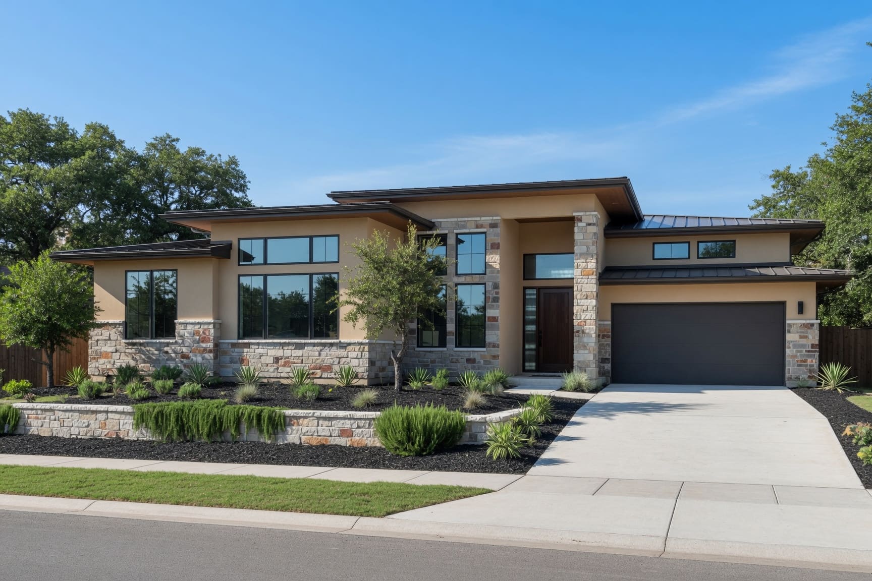 Contemporary Austin home exterior with stone facade and garage