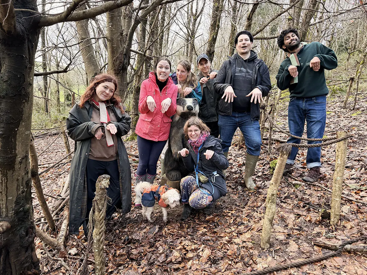 Froomies community exploring woodland trails and playfully posing like badgers
