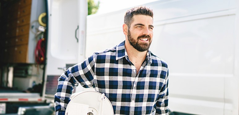 Low-Voltage installer walking to job site