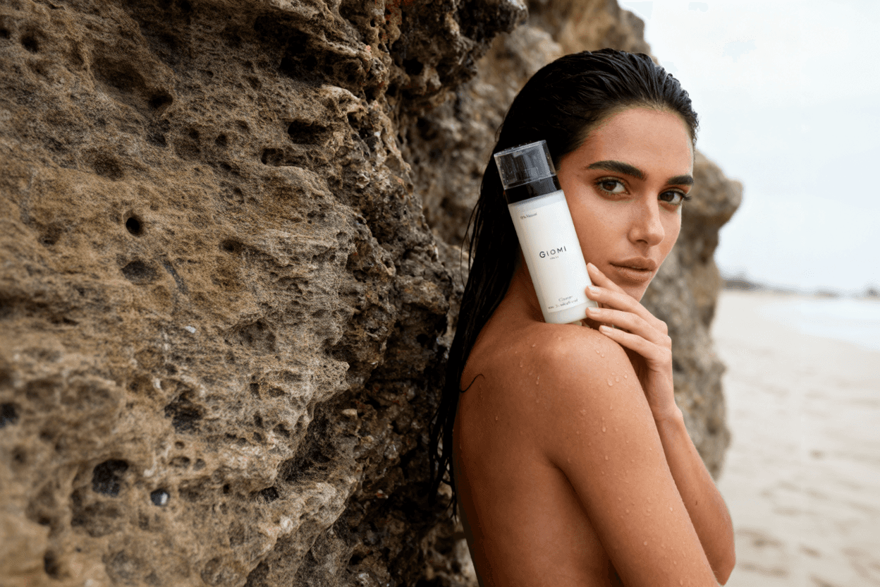 A fast black sports car races down the highway.