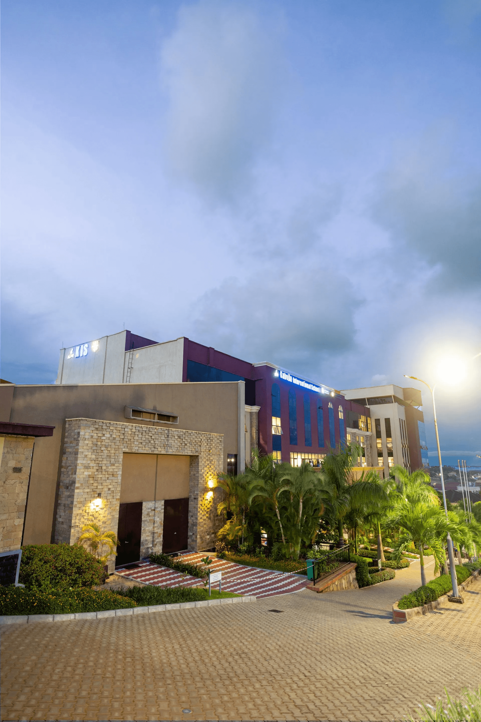 A school building stands against the backdrop of a clear sky