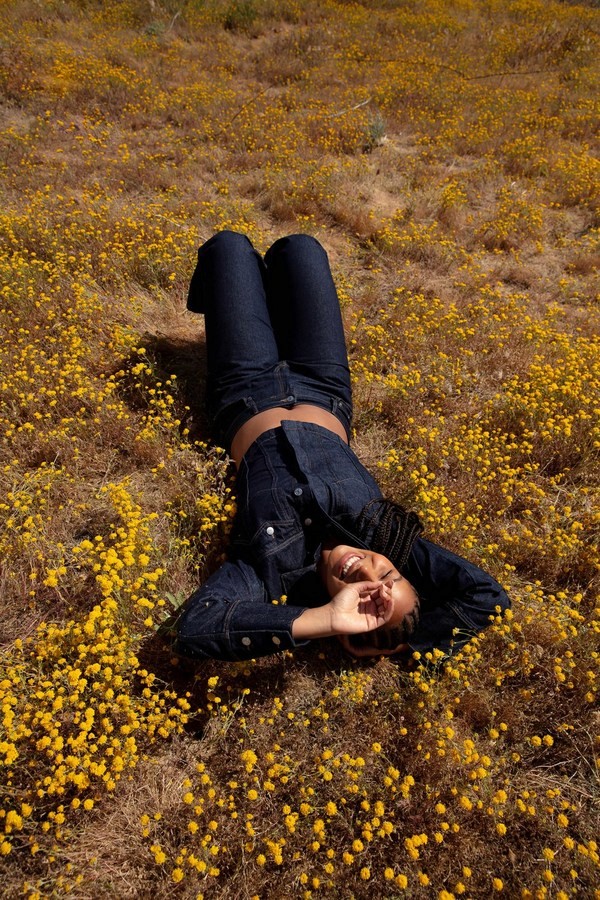person lying down on a grass field