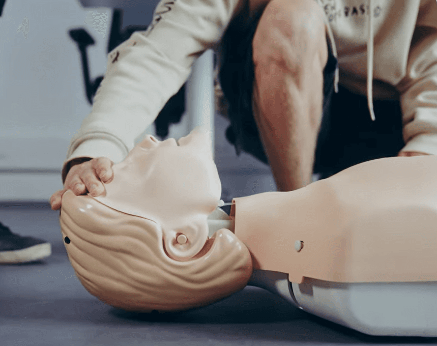 person sitting on grass and using phone