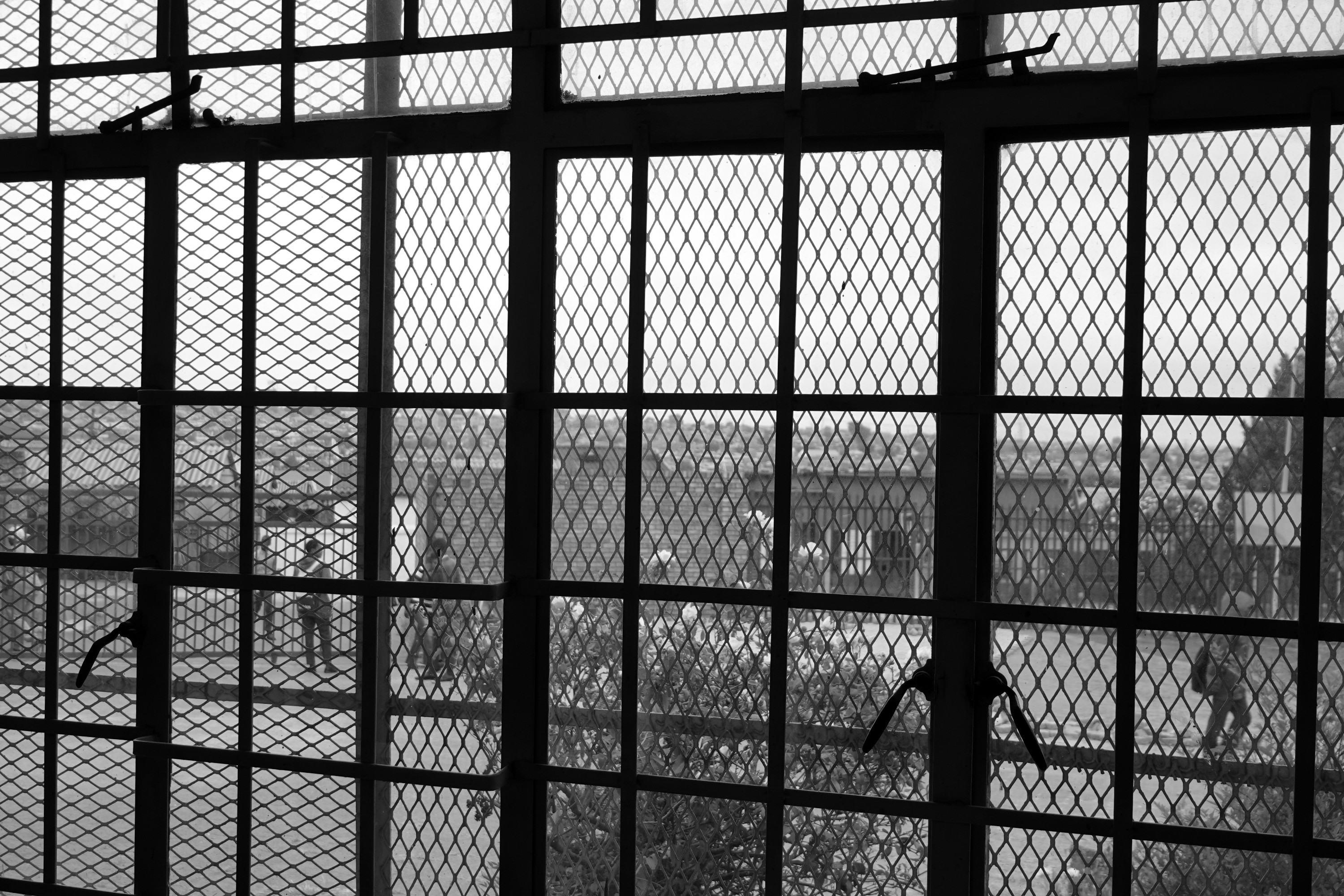 A metal mesh security gate at the school.