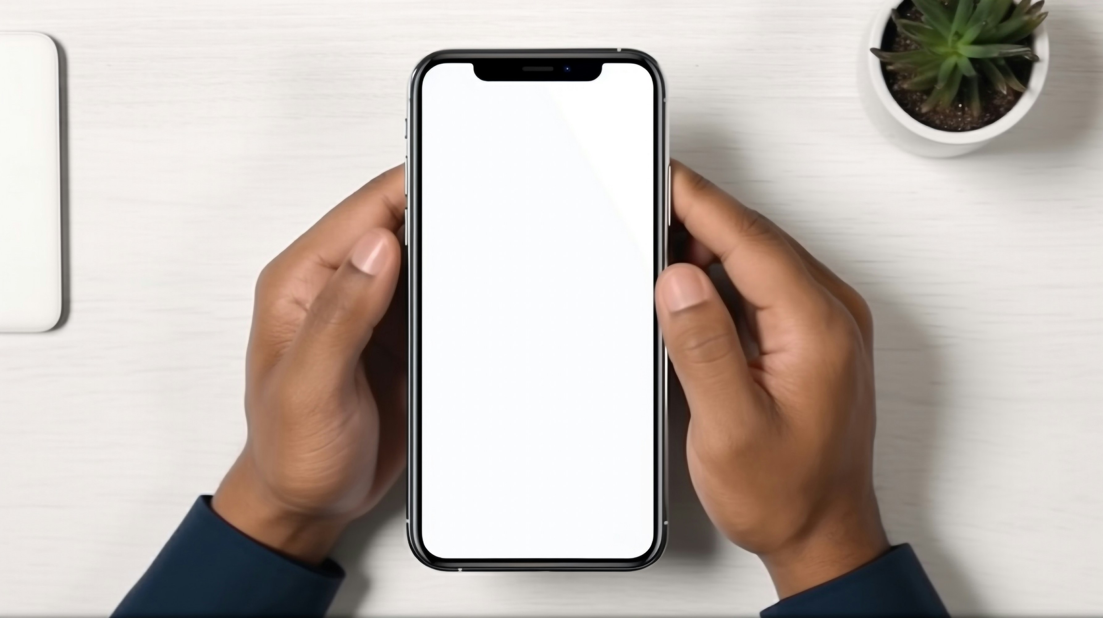 a person holding a phone with a white screen