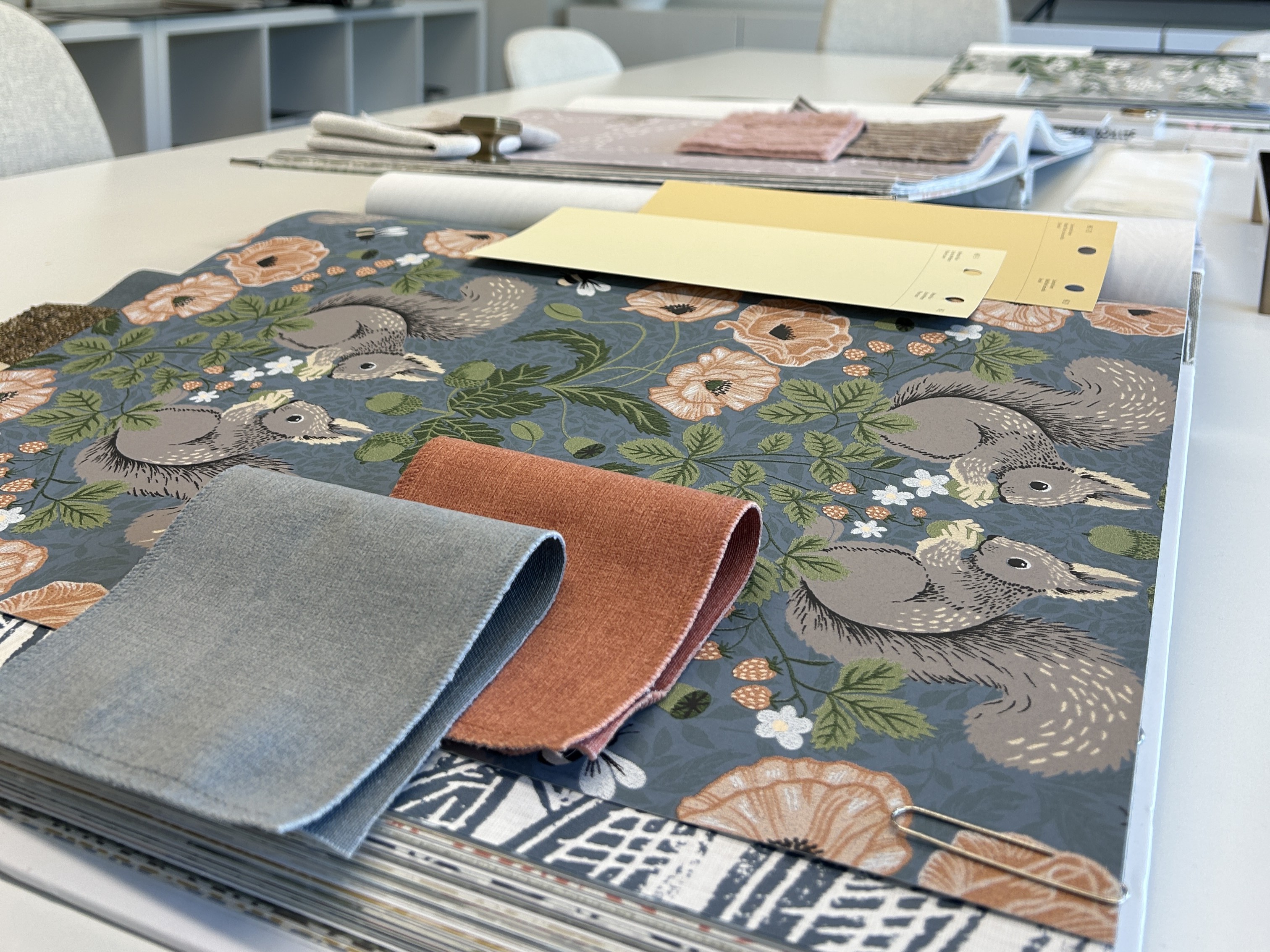 Image of KHD Homes design team selecting materials for interior design and window coverings for home renovations.