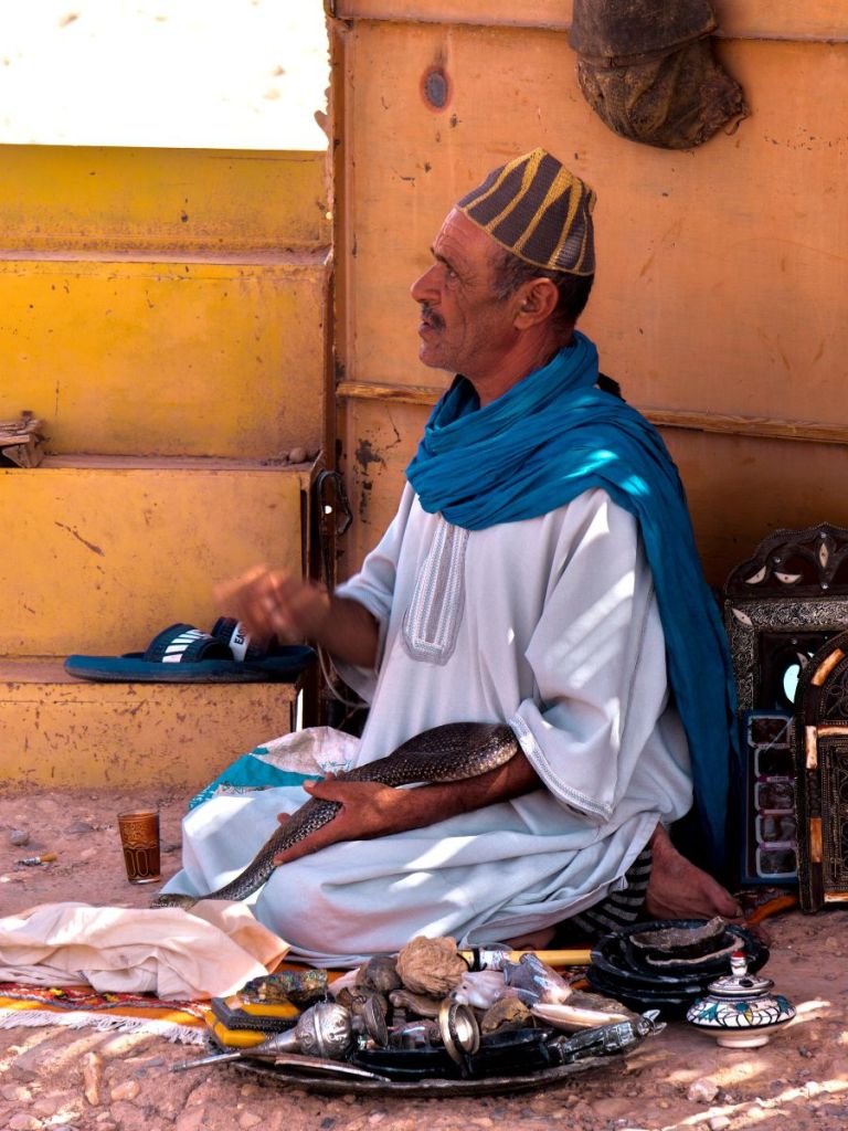 local man holding snake in ouarzazate