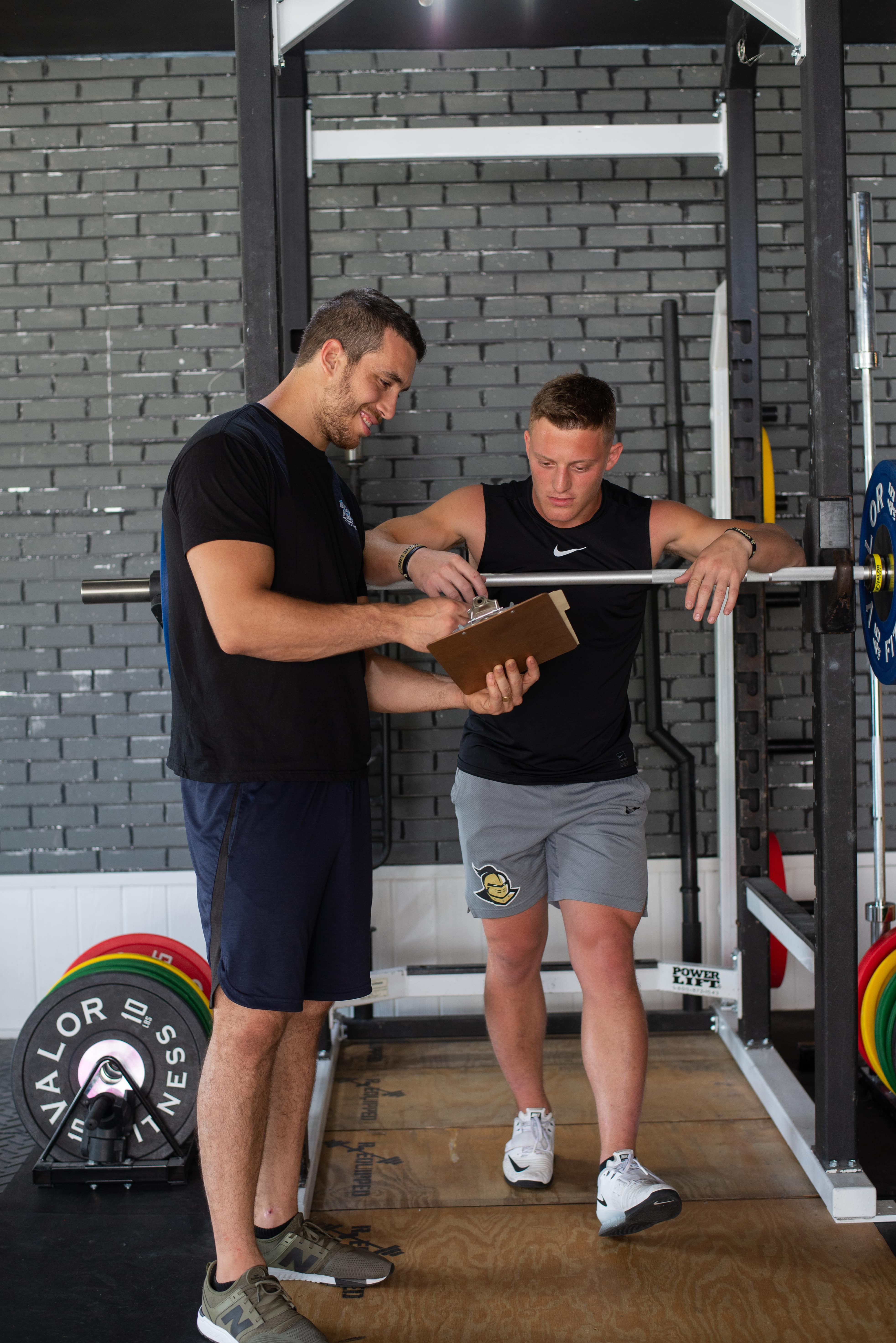 Friends using digital table at gym
