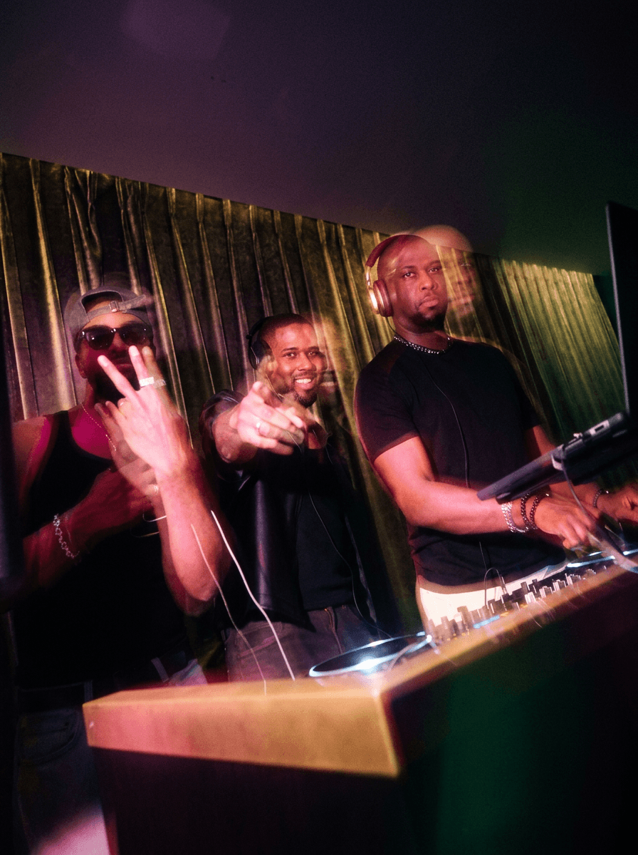 Bride and groom walking on street at night