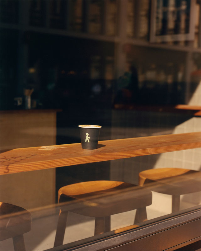 NKORA coffee cup and indoor seating
