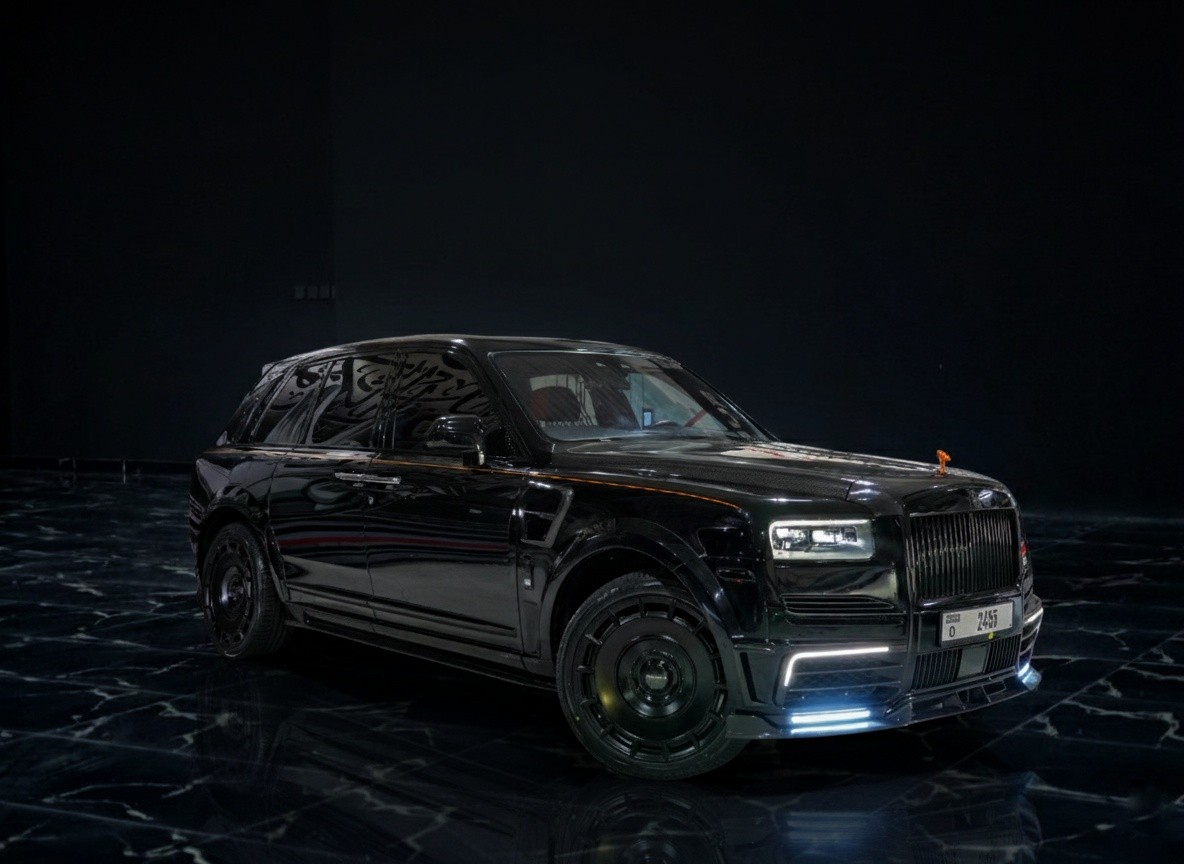Black Rolls-Royce Cullinan Mansory-style edition 2023 front corner exterior, luxury SUV with custom body kit and premium design