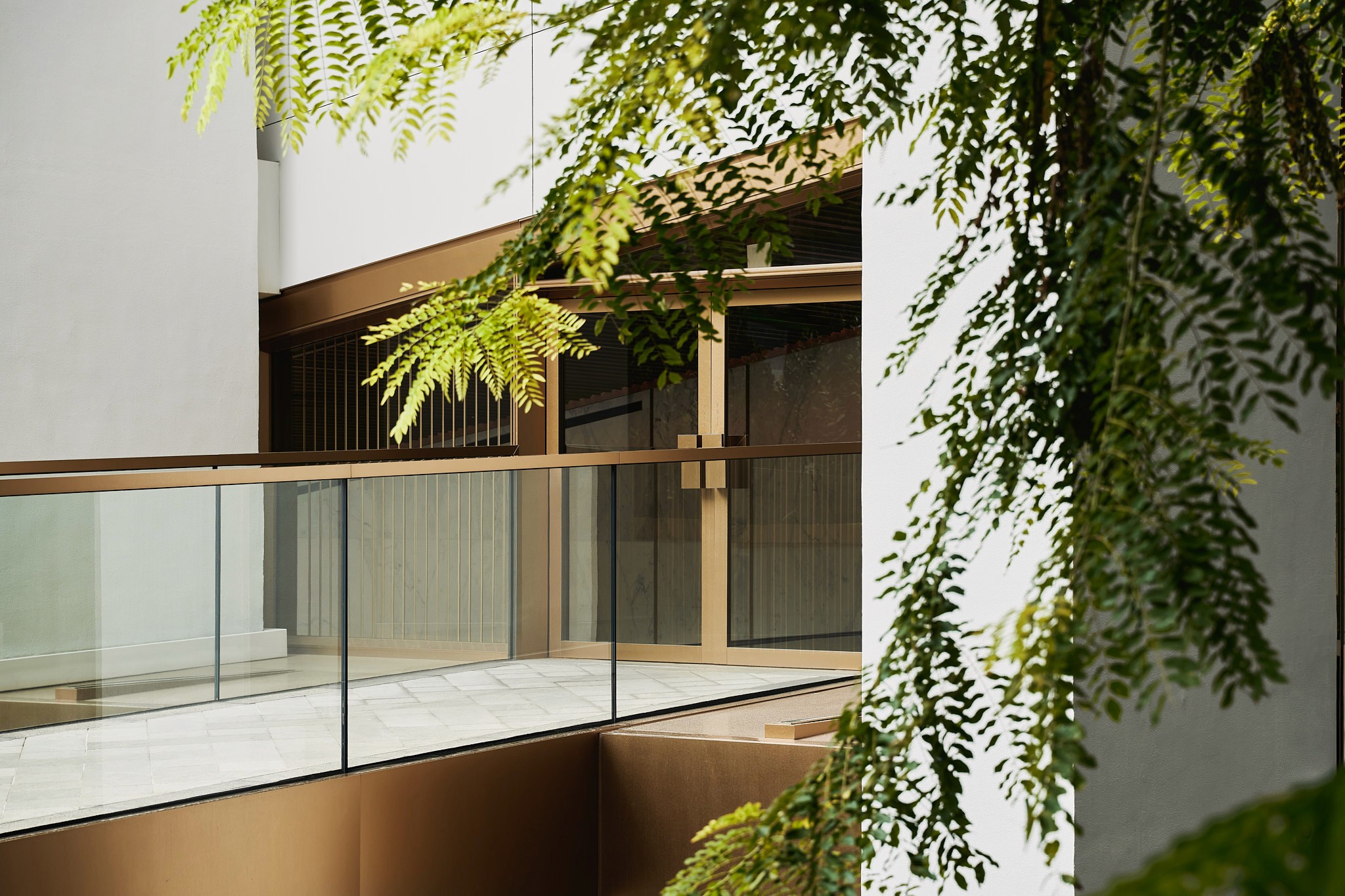 Editorial style images of hands covered in clay forming the bowl.