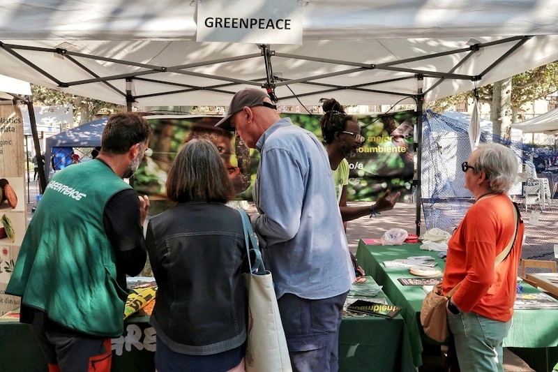 Volunteers at a community environmental awareness booth