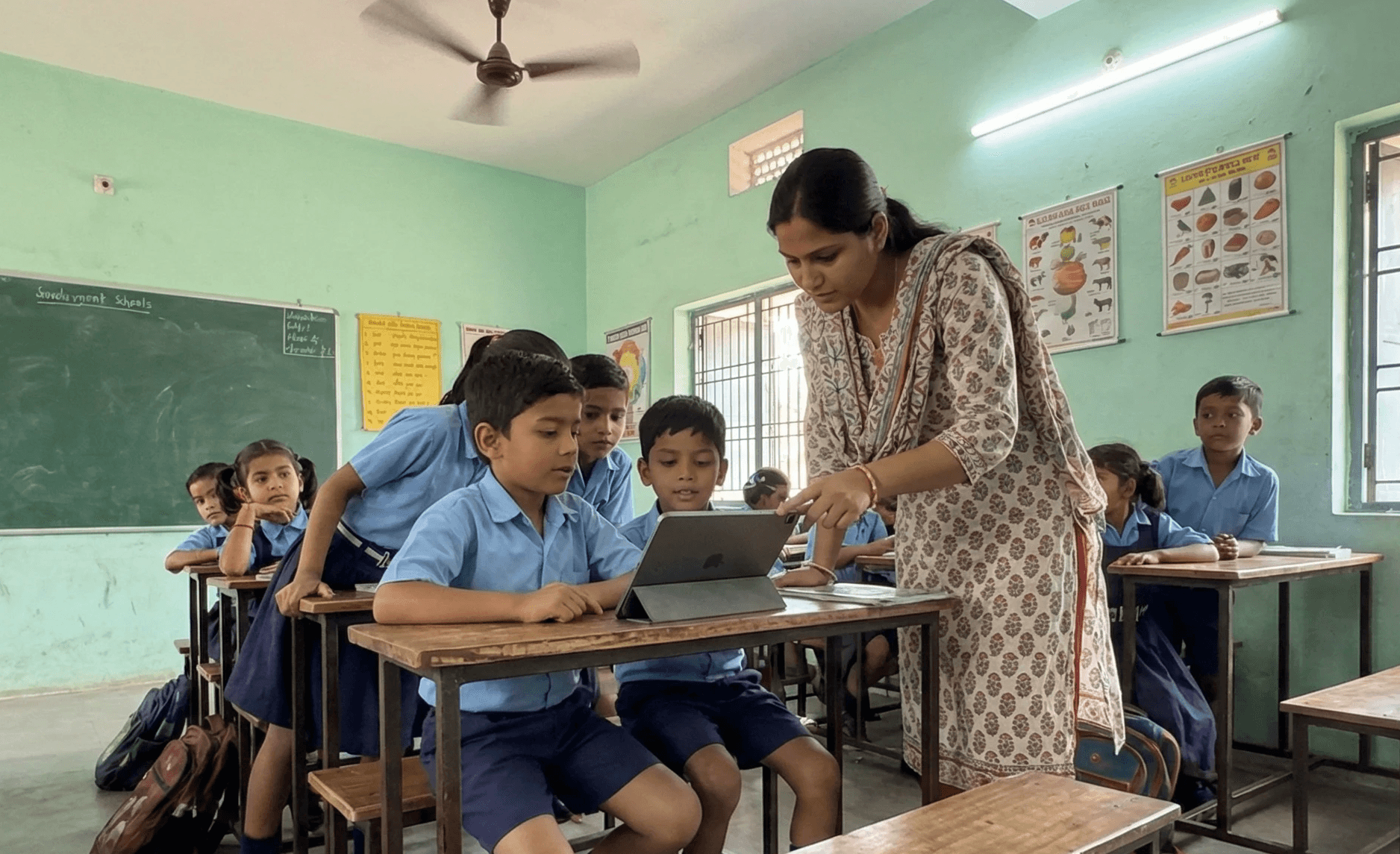 a group of children standing around each other