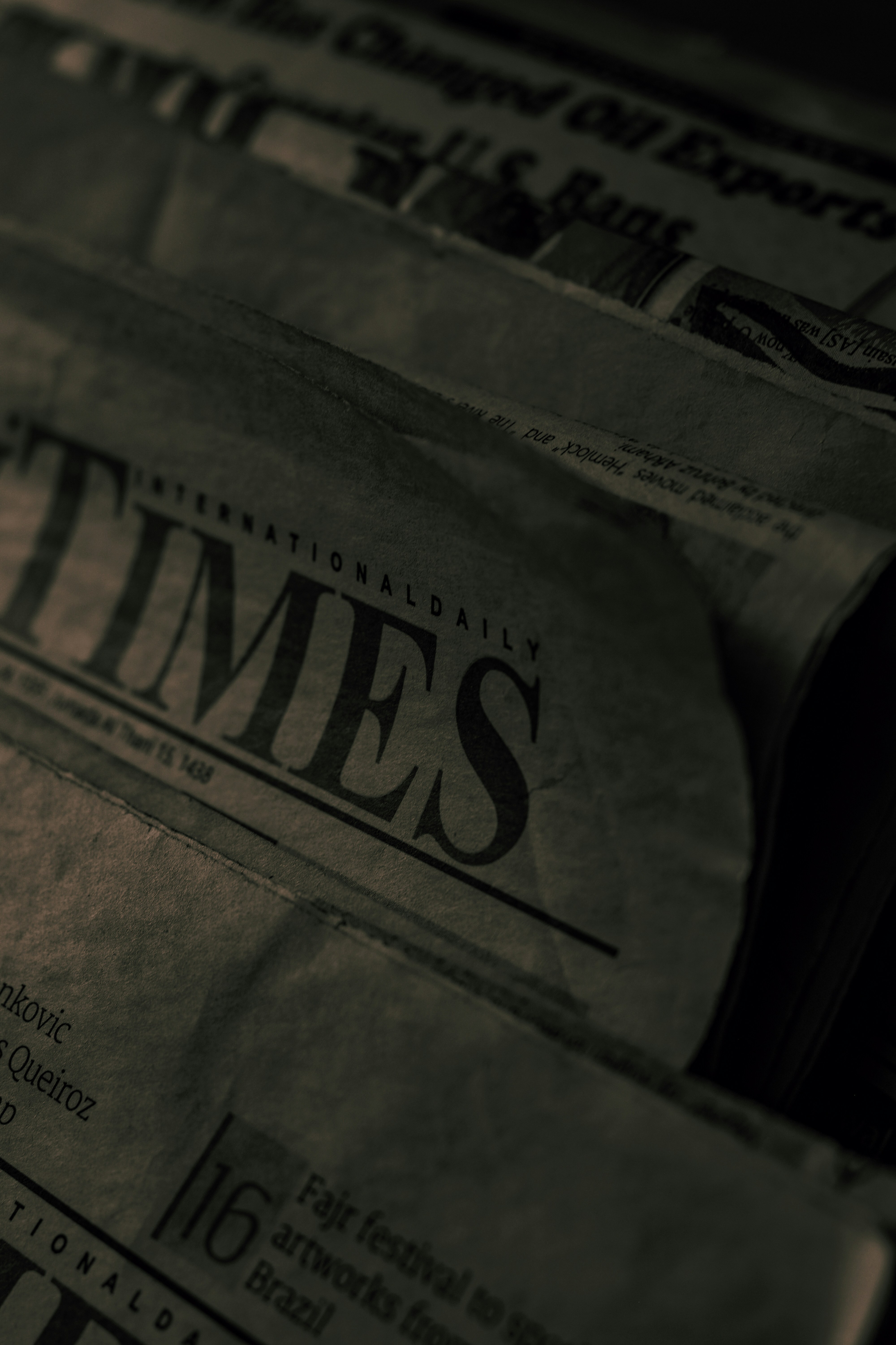newspapers stacked on top of each other on a table