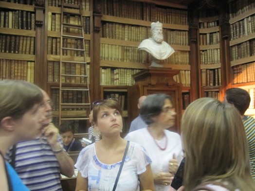 A photo of a group of students sitting in an old library.