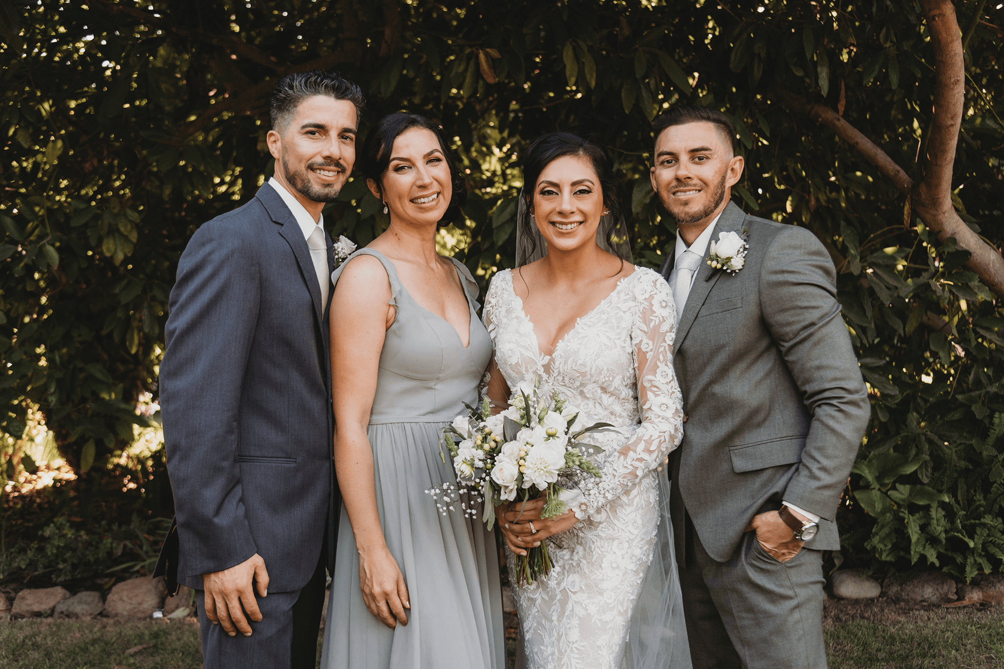 Flat lay wedding details with bouquet, rings, and sparkling bridal heels